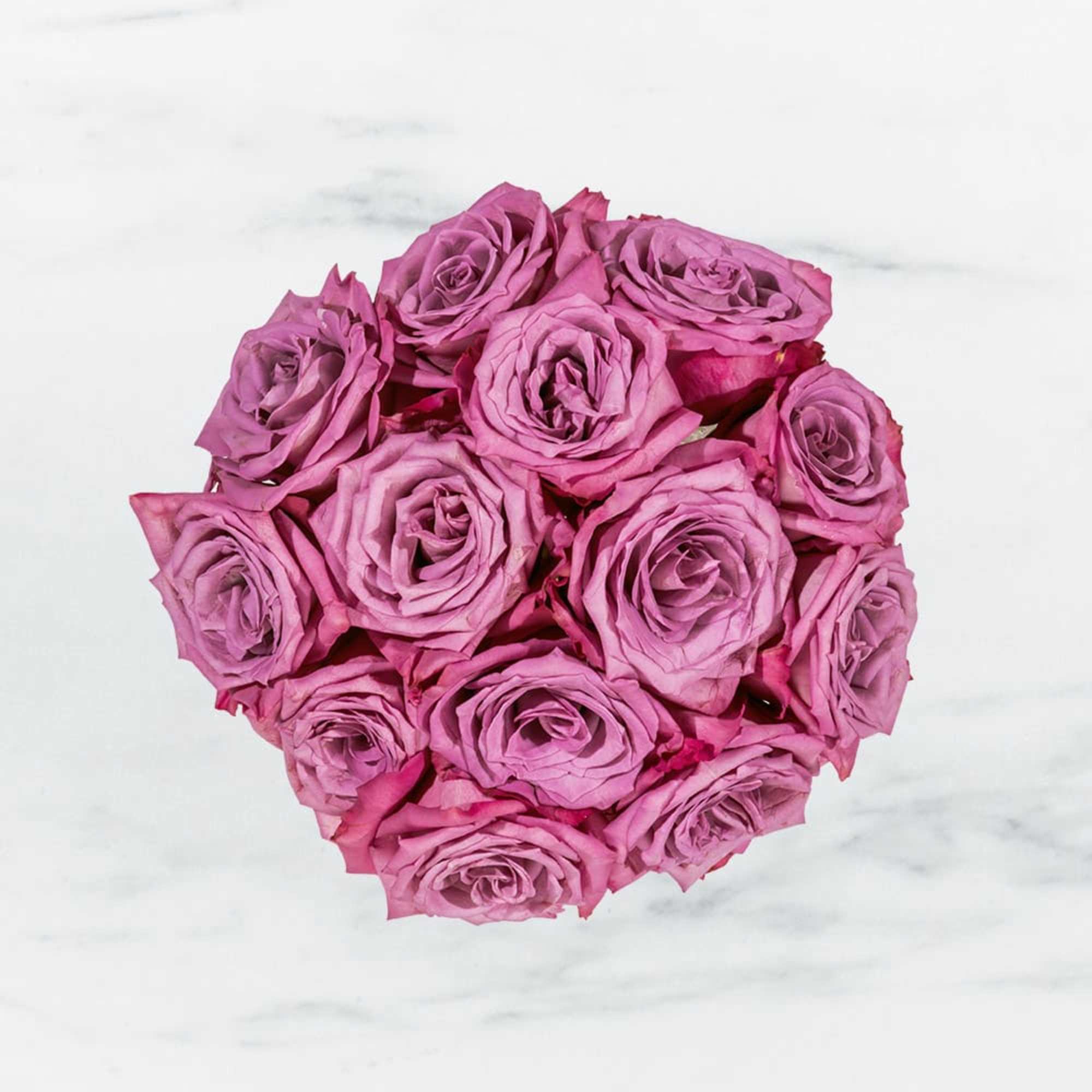 Round bouquet of pink roses on a white background