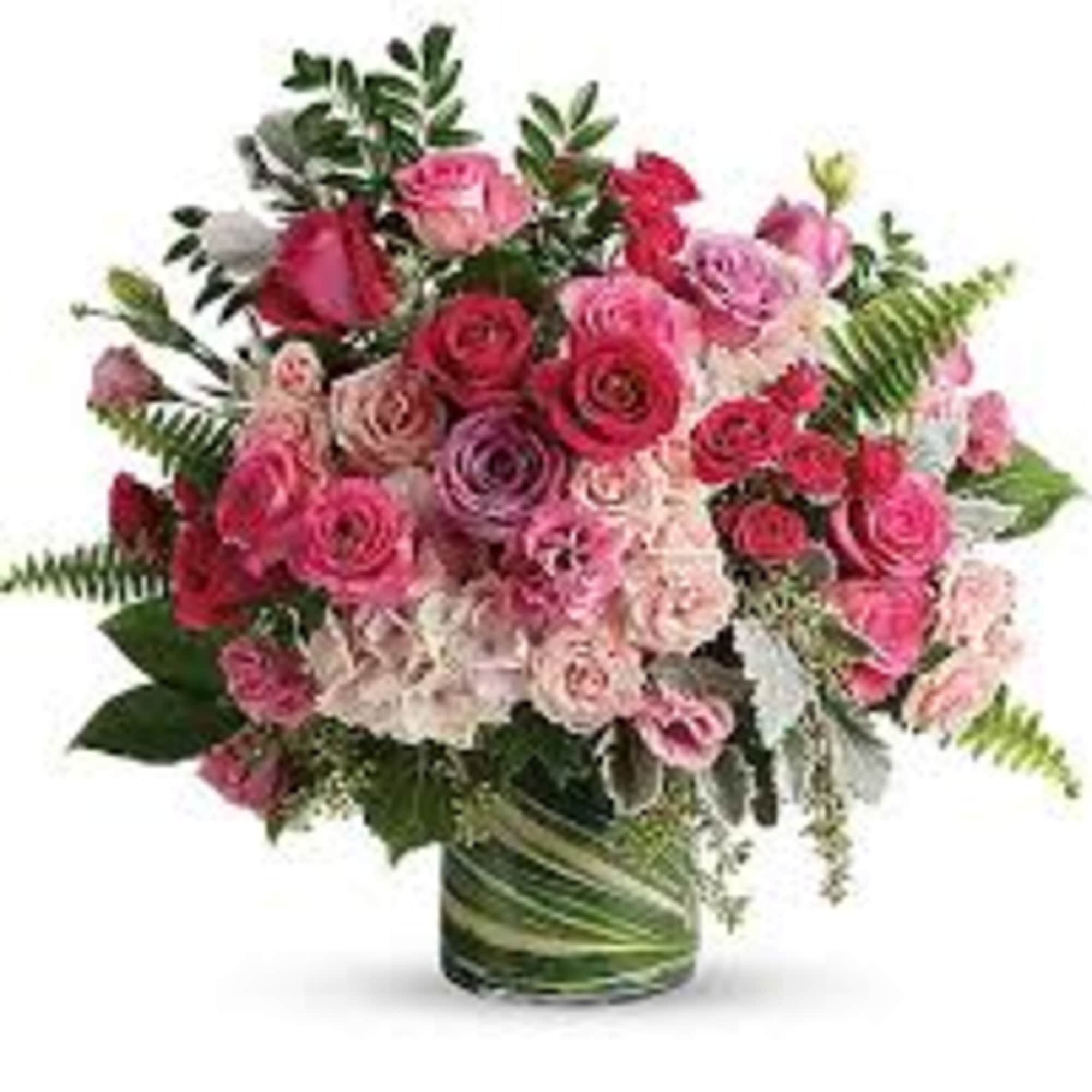 Bouquet of pink and red roses in a glass vase