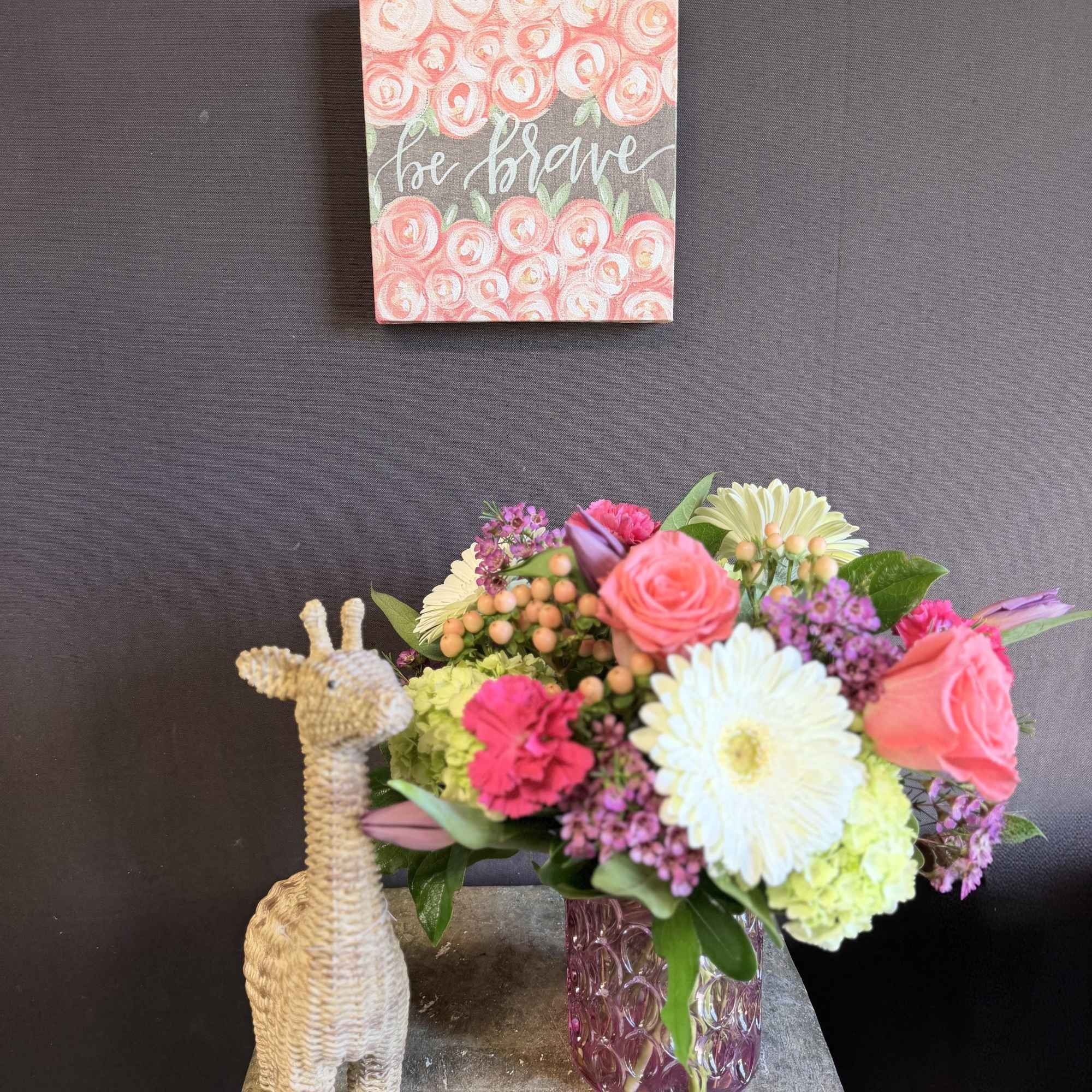 Bright, joyful, and full of encouragement, our Be Brave Blooming Giraffe Bouquet