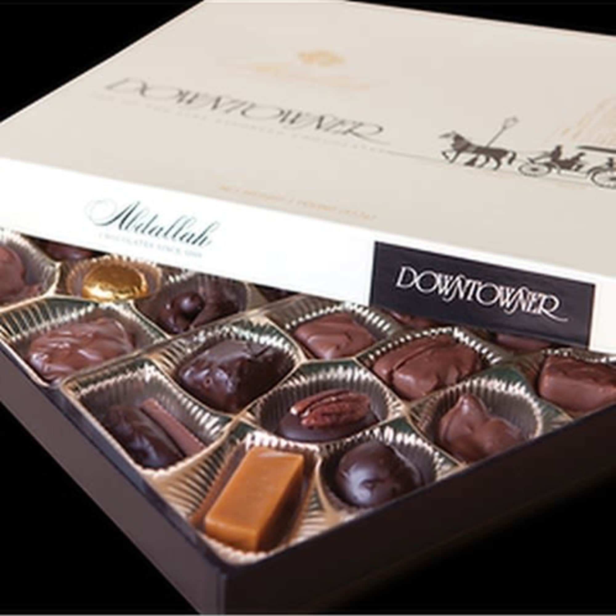 Box of assorted chocolates with a white lid