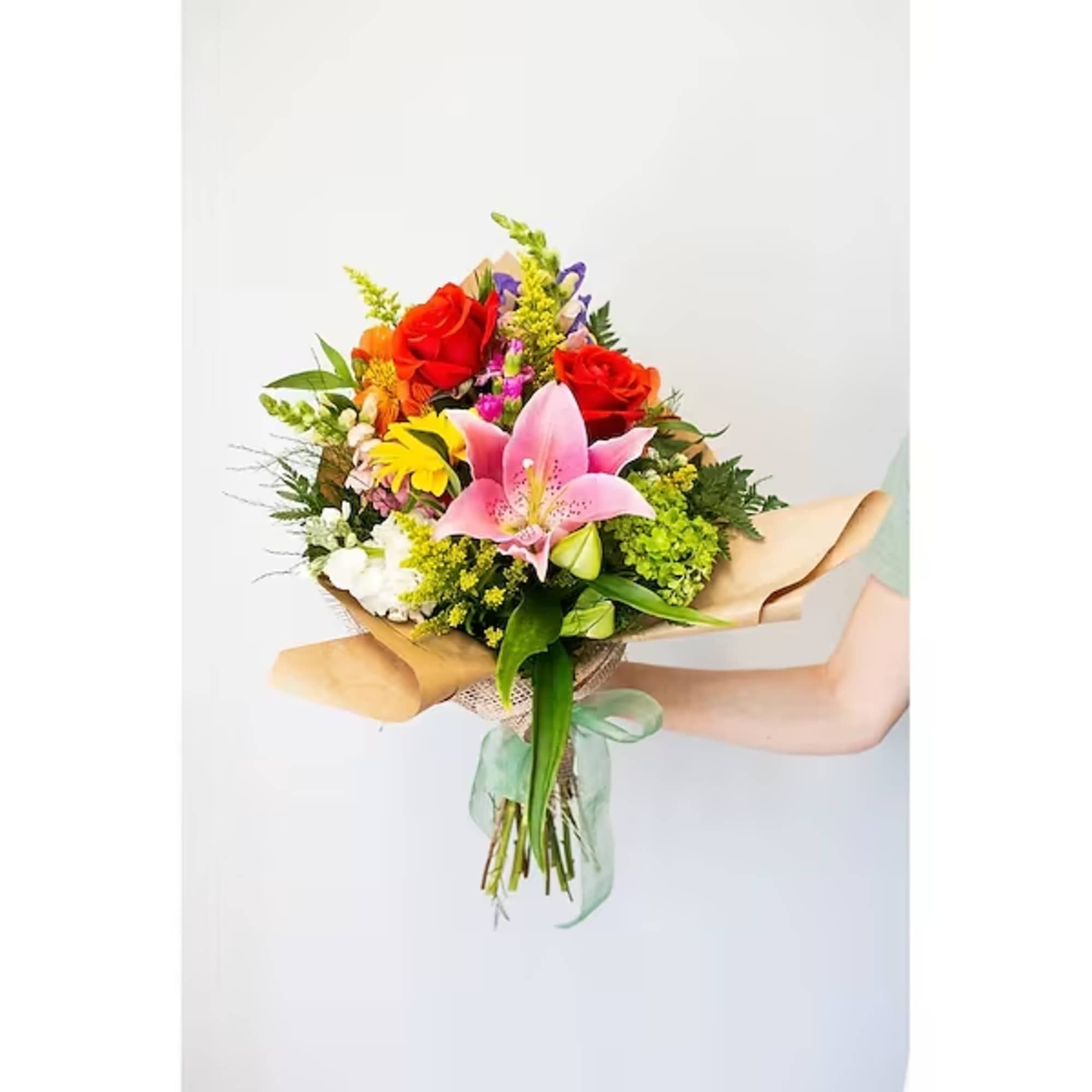 Hand-tied bouquet with pink lilies and mixed colorful flowers