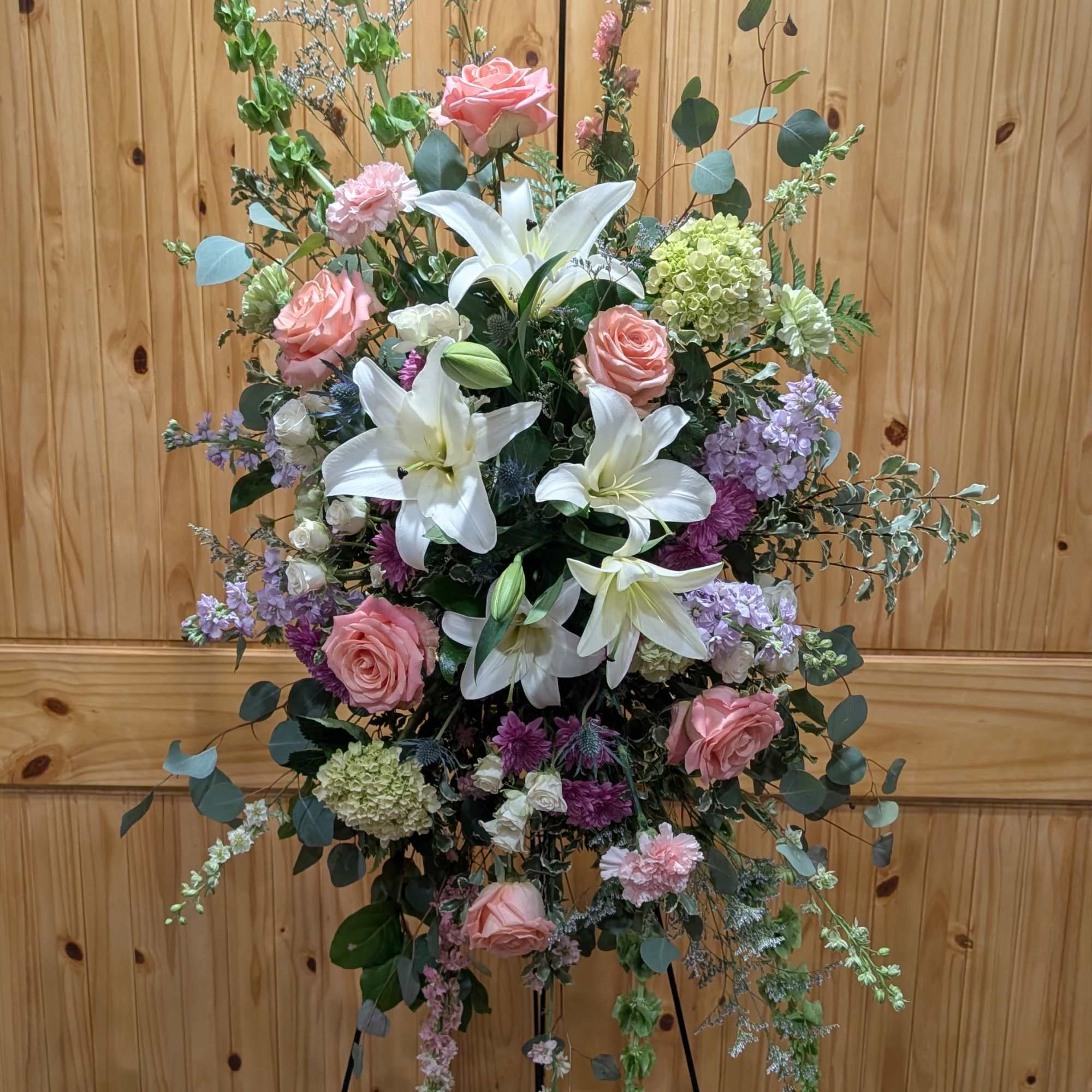 Standing spray includes, White Lilies, Pink &amp; White  Roses, Hydrangeas, Violet