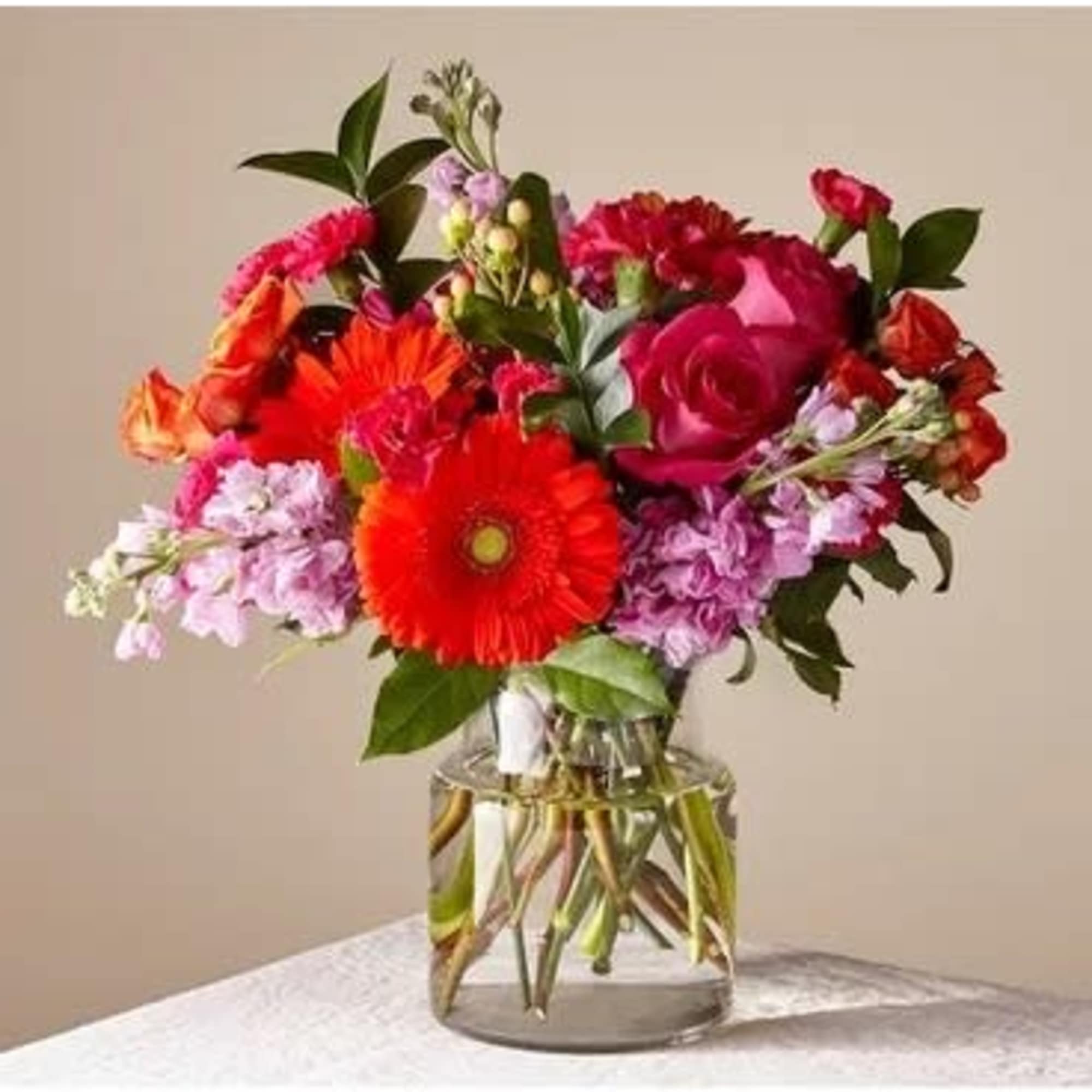 Bright mixed bouquet in a clear glass vase