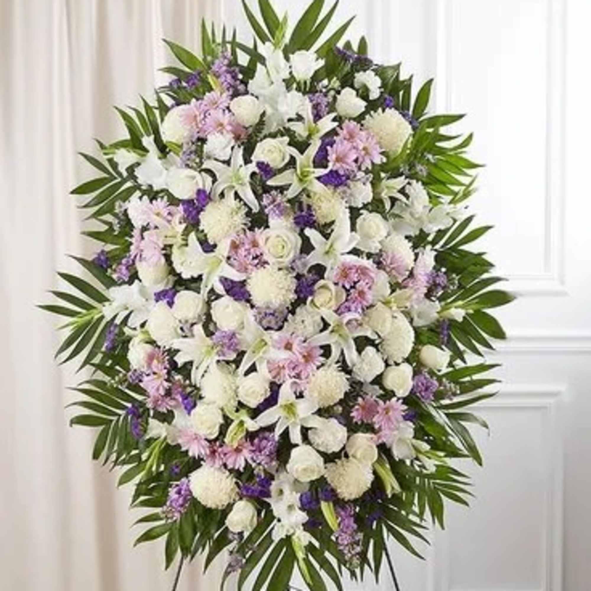 Standing floral spray with white, pink, and purple flowers