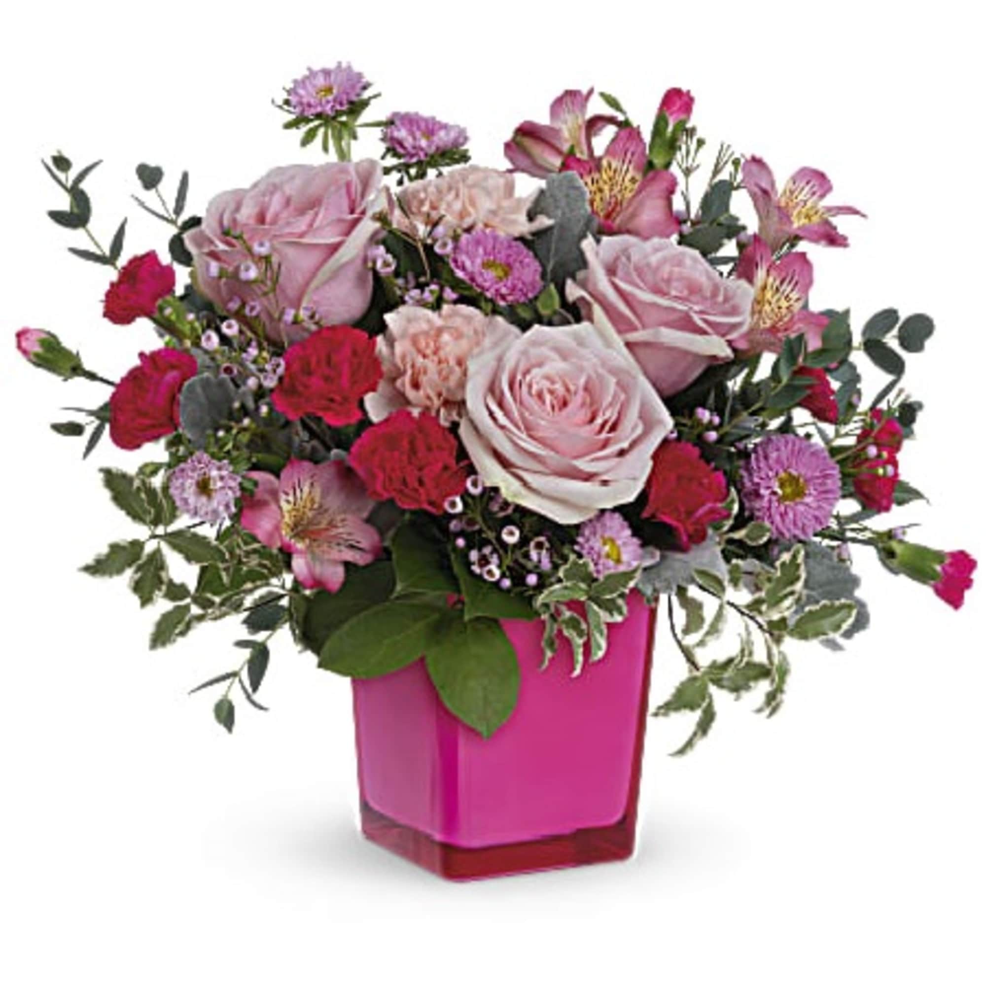 Pink roses and mixed blooms in a bright pink vase