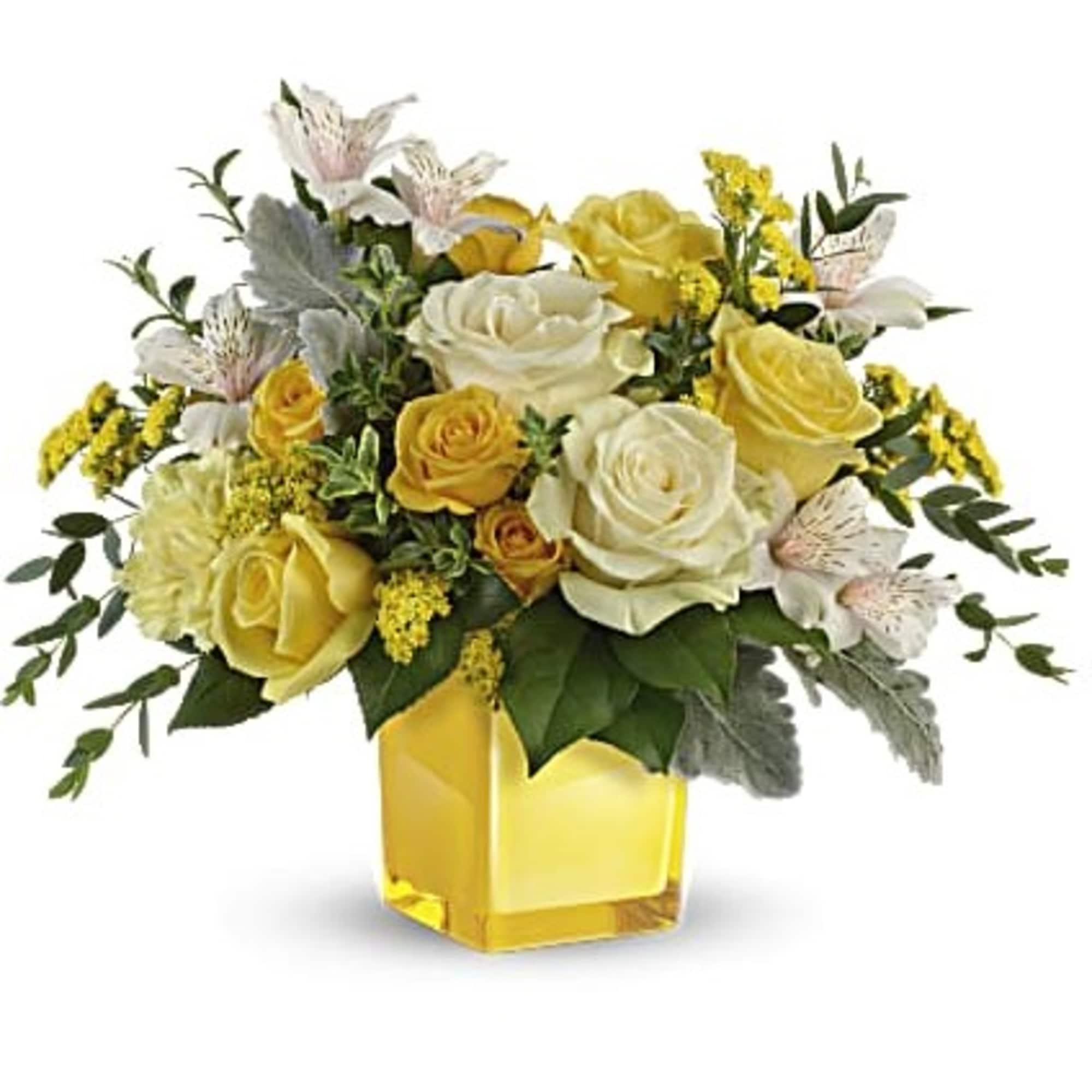 Yellow and white rose bouquet in a square glass vase