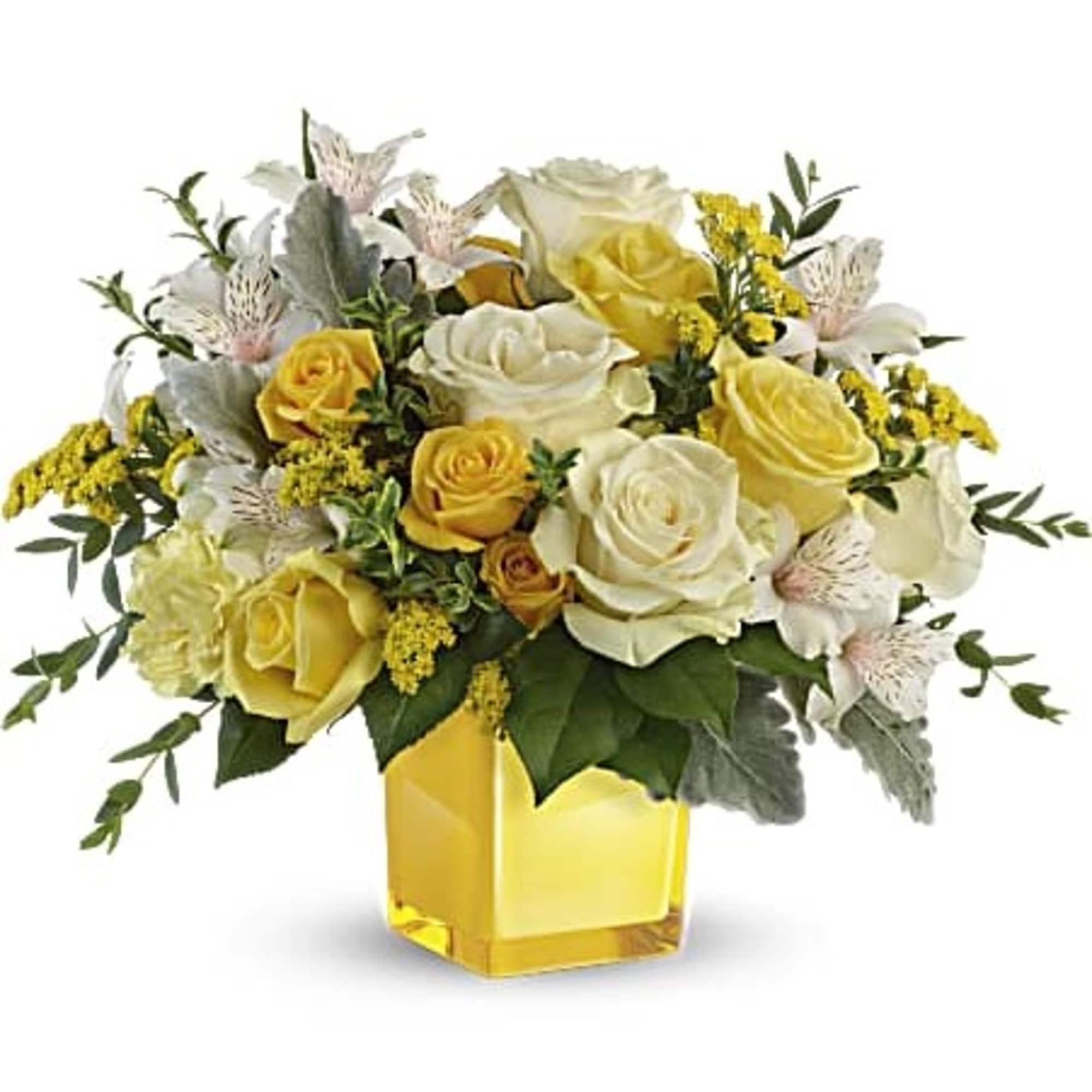 Yellow and white rose bouquet in a square glass vase