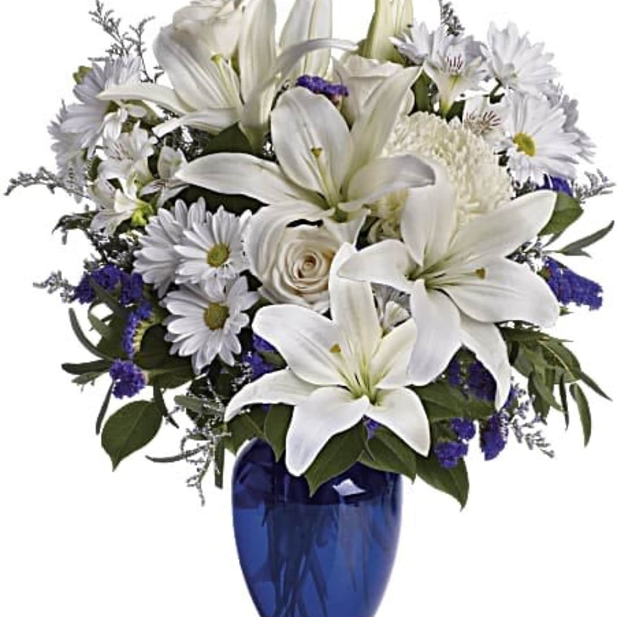 White lilies and daisies arranged in a blue vase