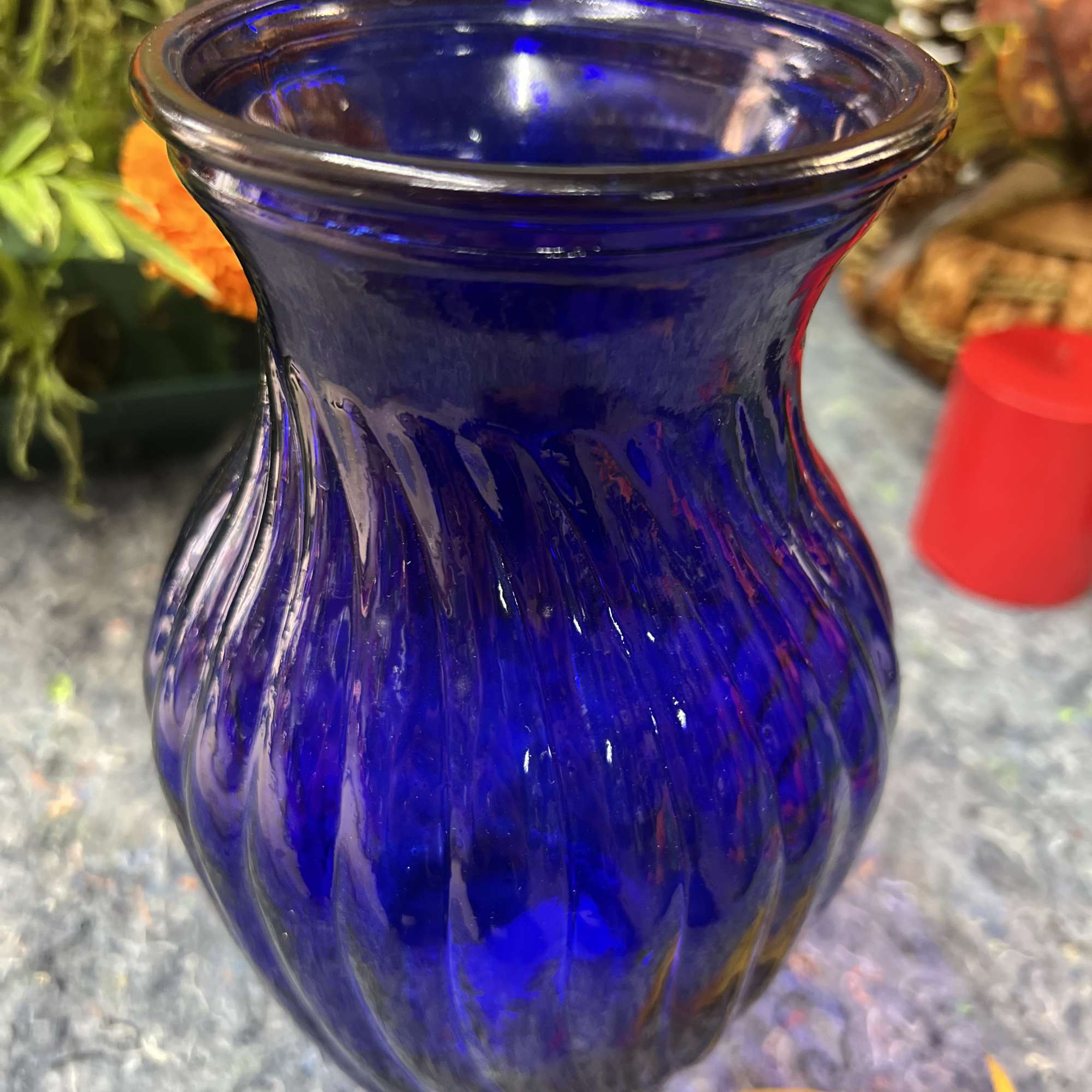 Blue glass vase on a countertop