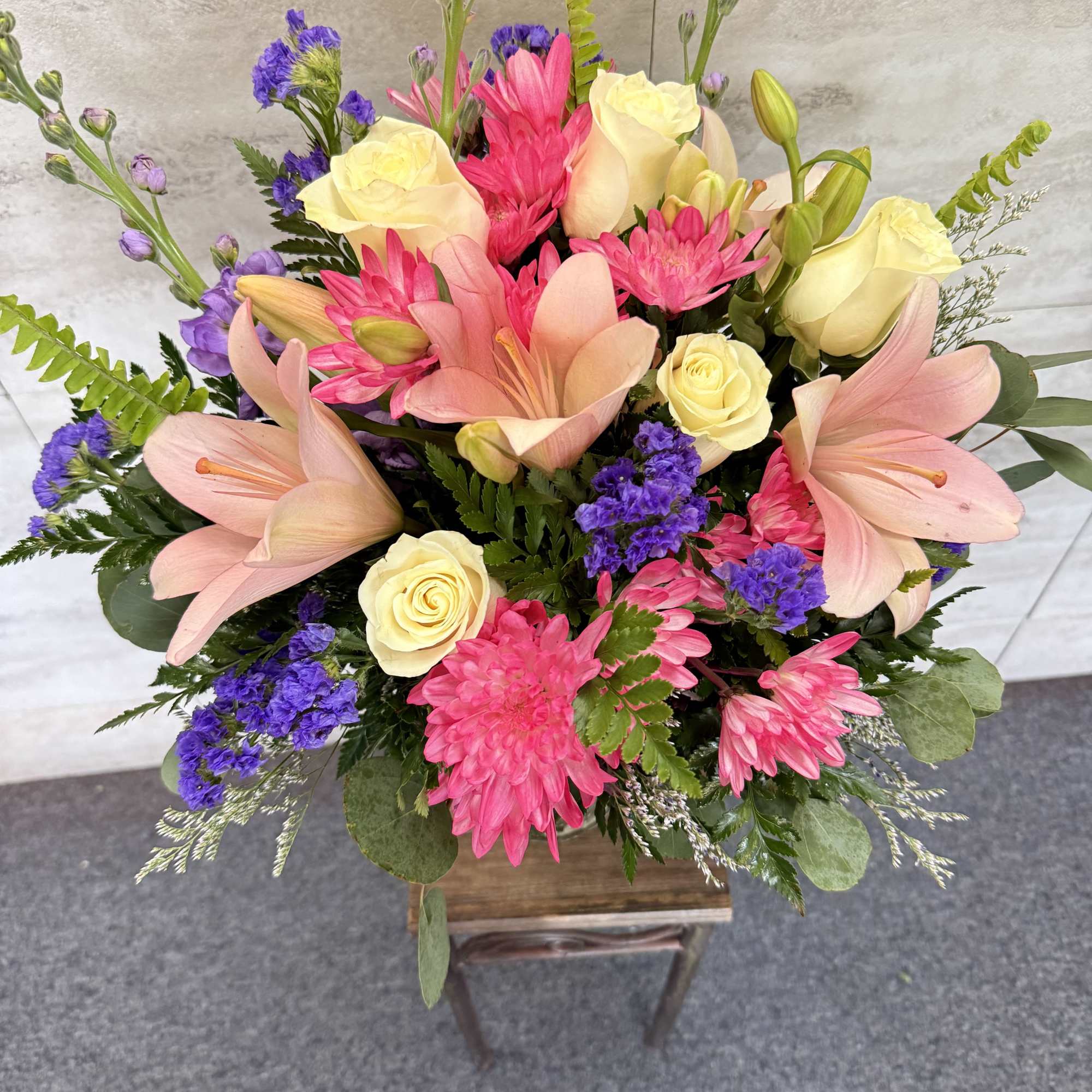 (ALL-ROUND) This vibrant and lush floral arrangement features a mix of soft, photo 2 of 2