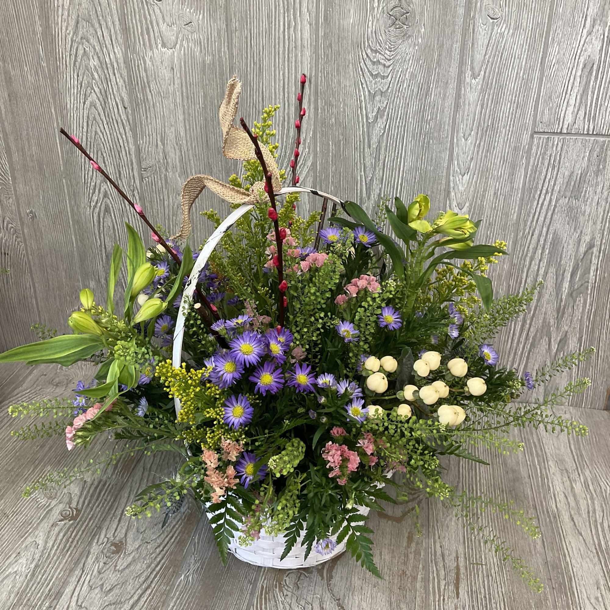 A beautiful and colorful arrangement of wild flower style fresh cut flowers