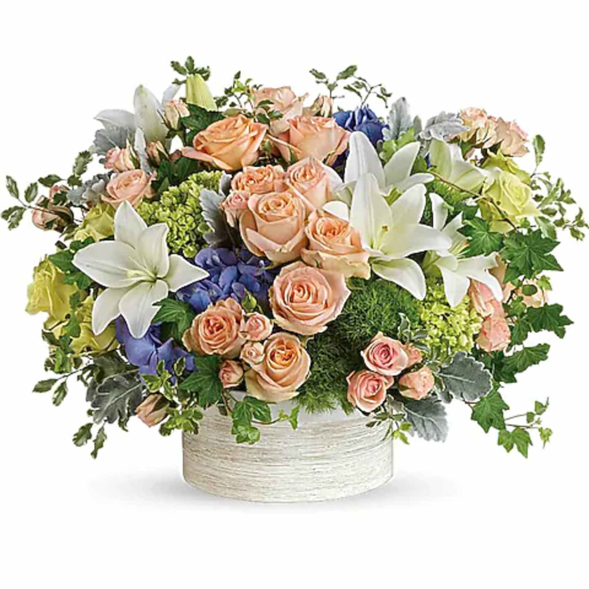 Peach roses and white lilies arranged in a round white container