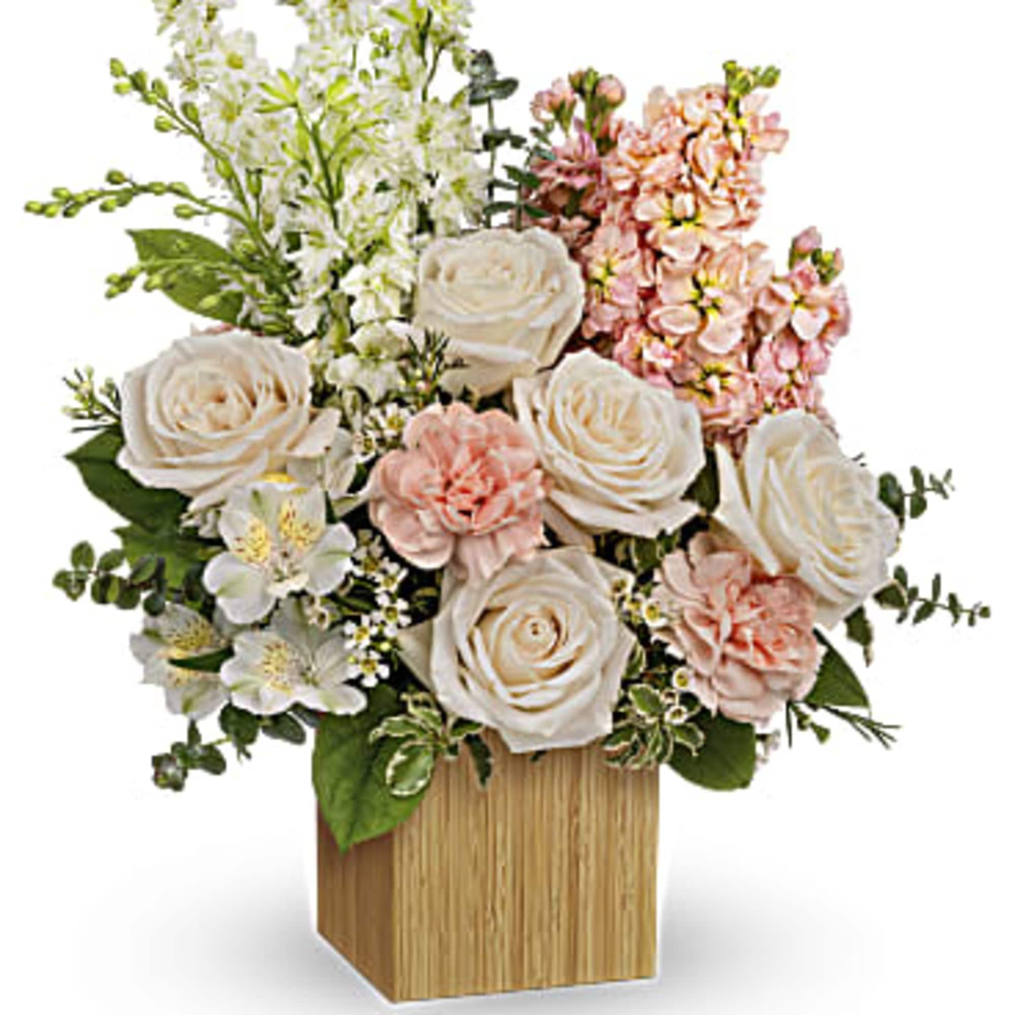 Celebrate your adoration with this artistic bouquet of creamy blooms and lush