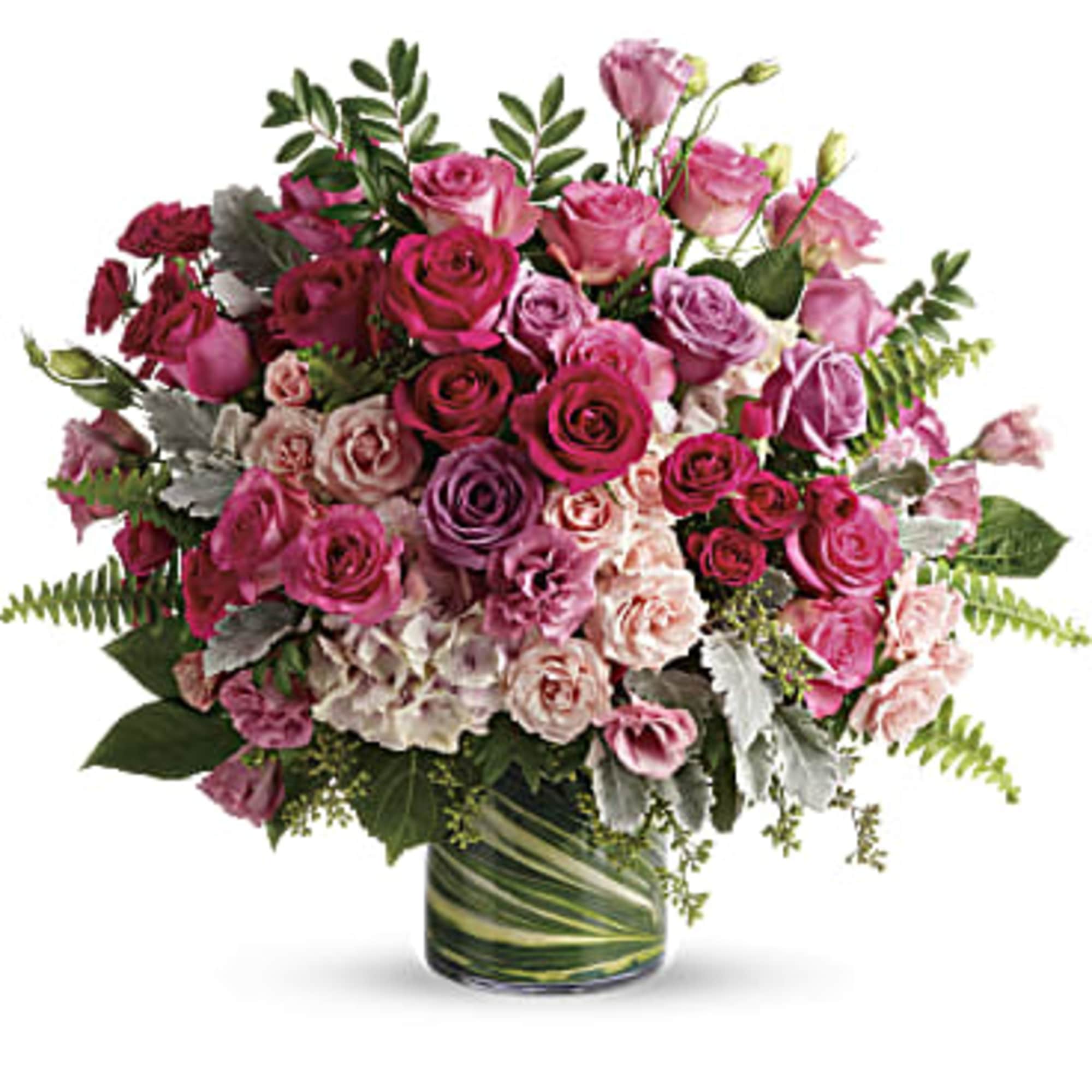 Bouquet of pink and purple roses in a glass vase