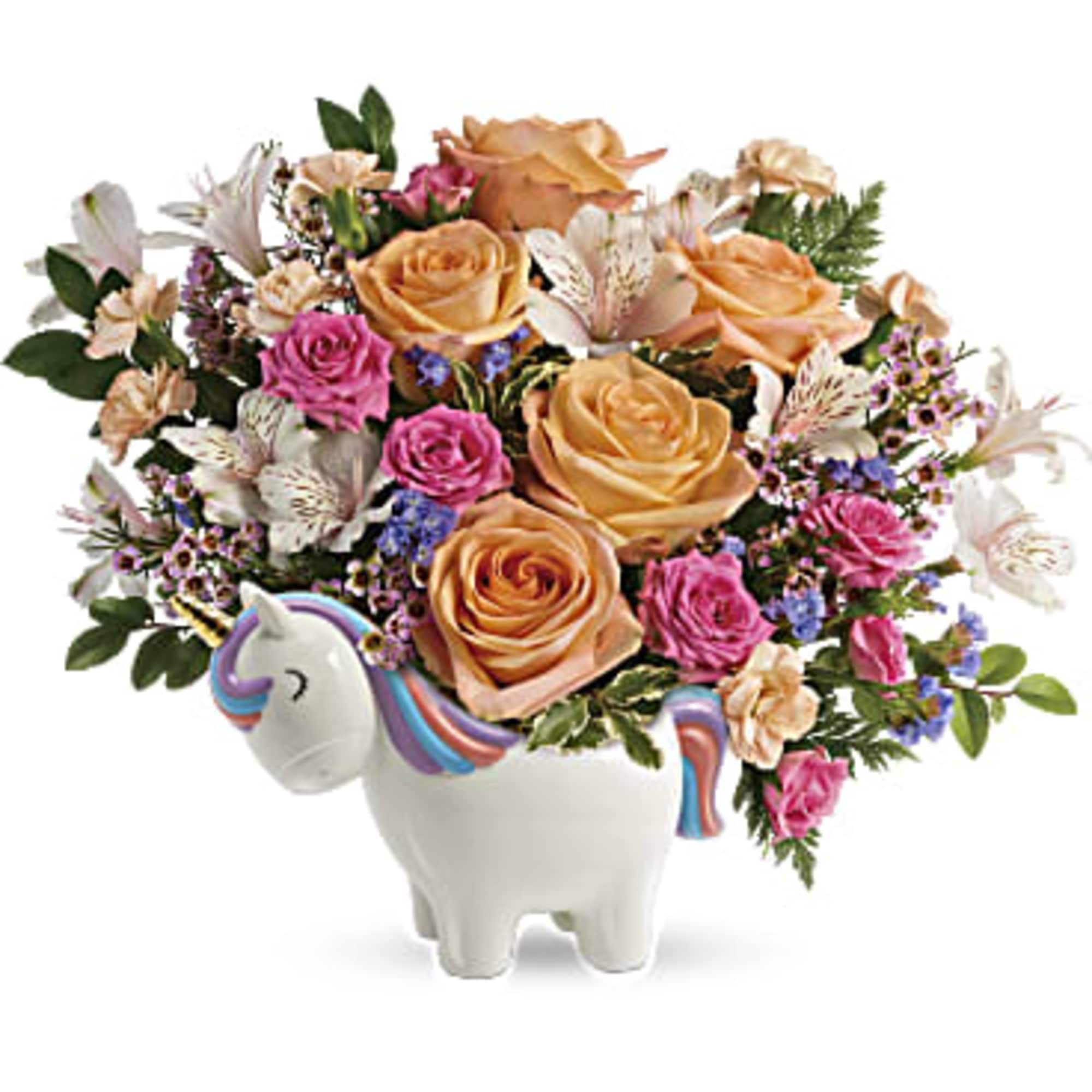 Bouquet of peach and pink roses in a unicorn-shaped vase