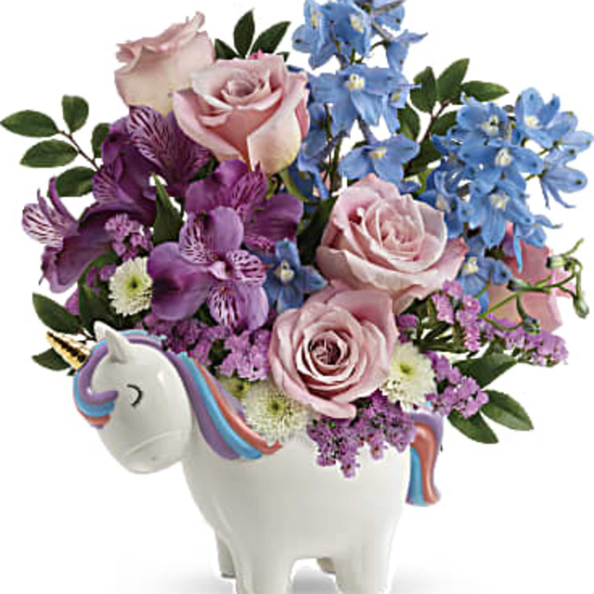 Pink and blue flower arrangement in a unicorn-shaped vase