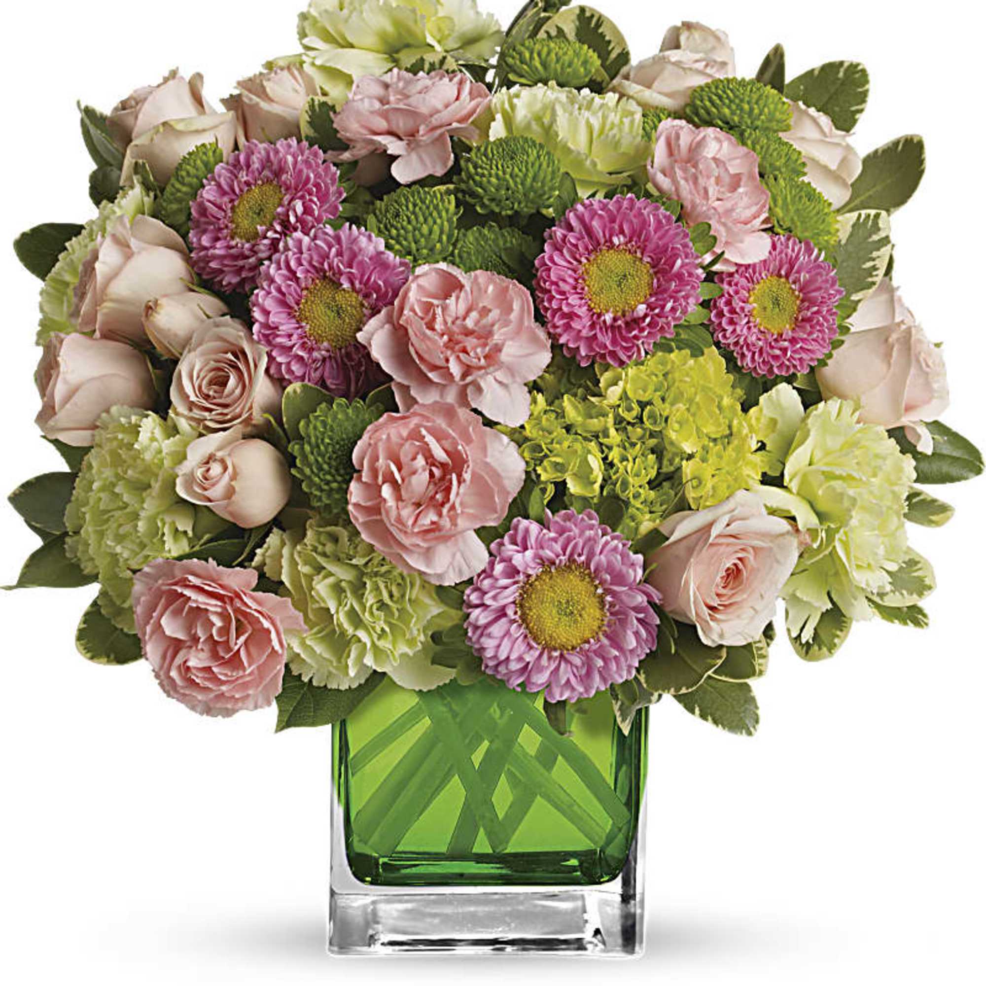 Pink and green mixed bouquet in a square glass vase