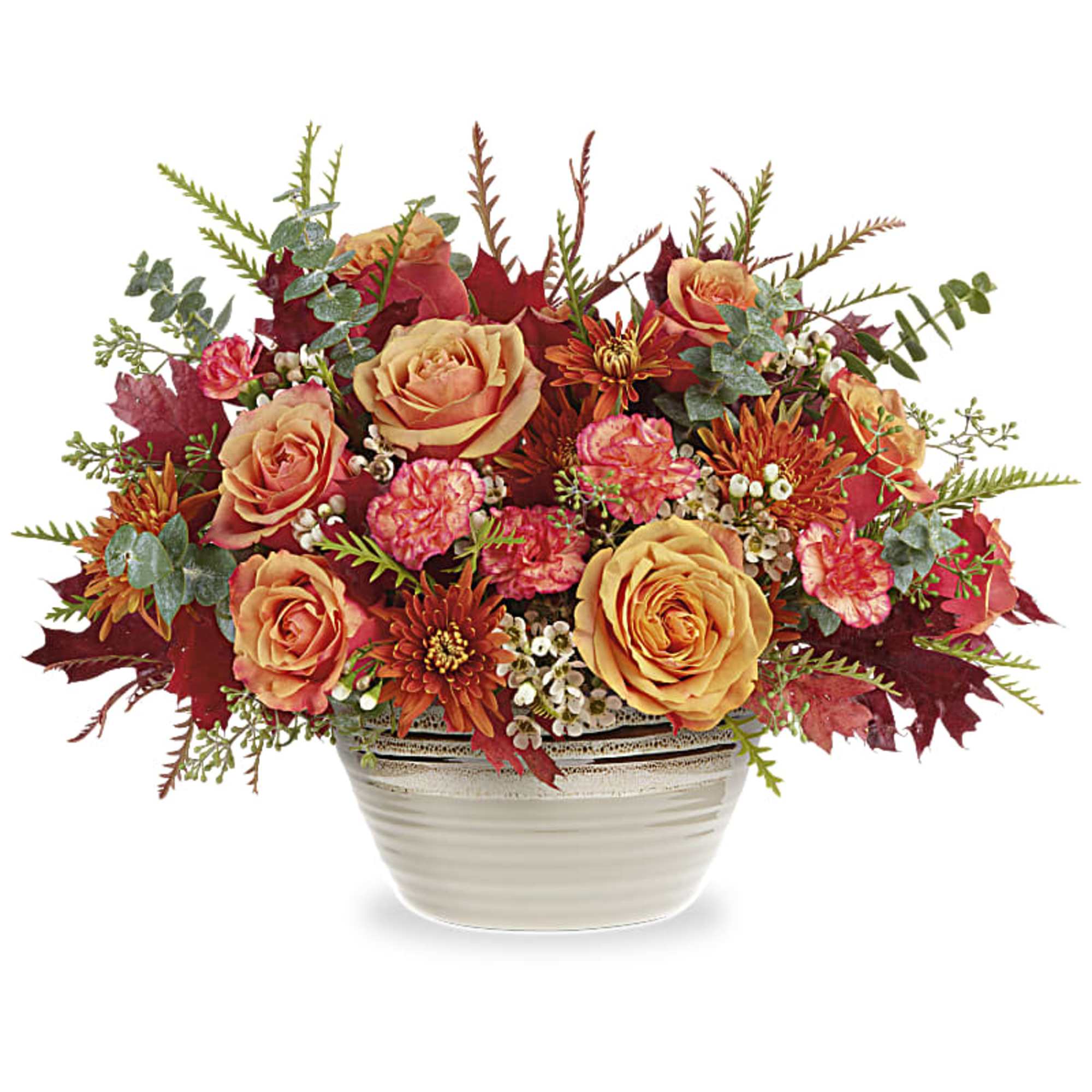 Autumn floral arrangement with peach roses in a white ceramic vase