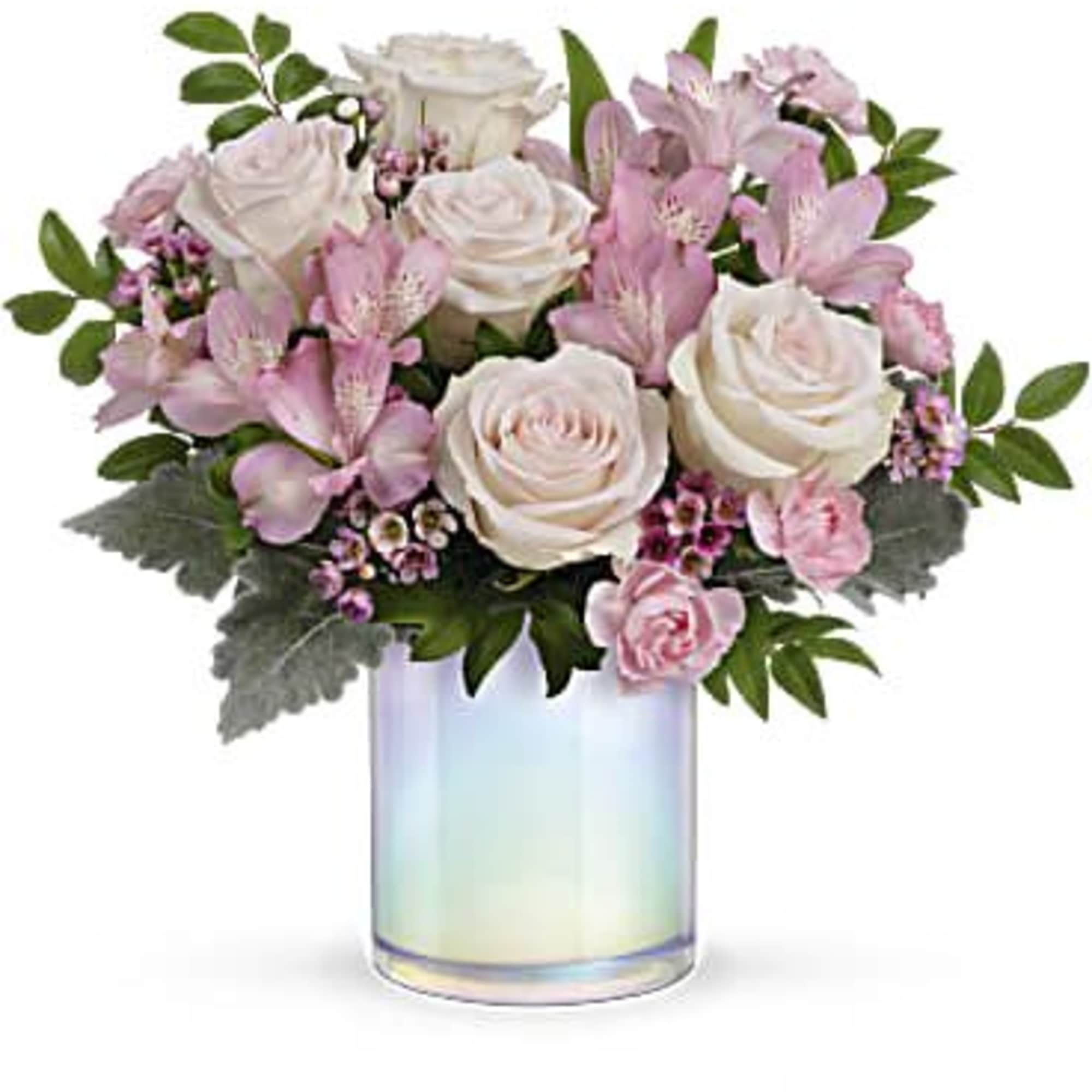 Pink and white roses with lilies in an iridescent glass vase
