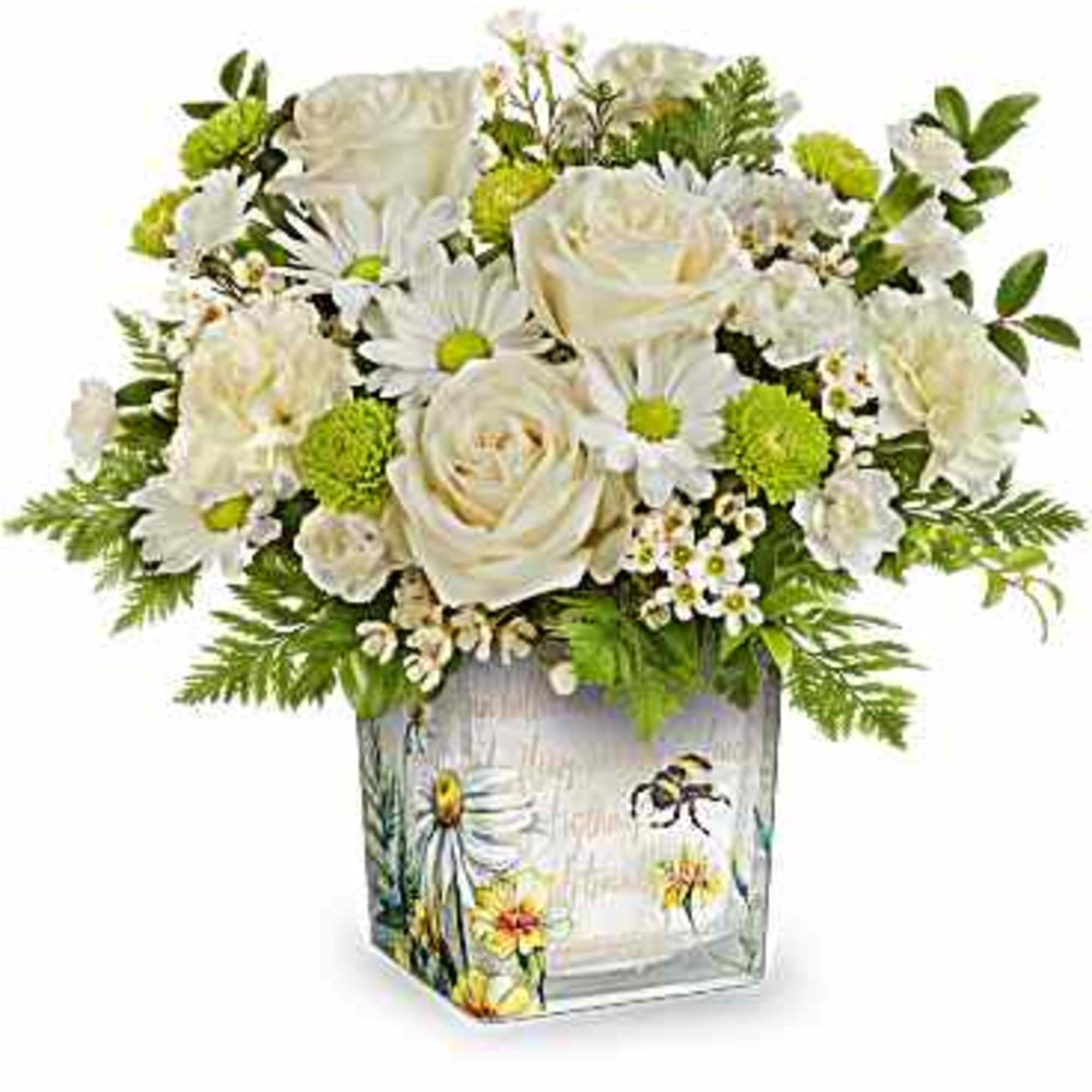 White roses and daisies in a painted glass vase