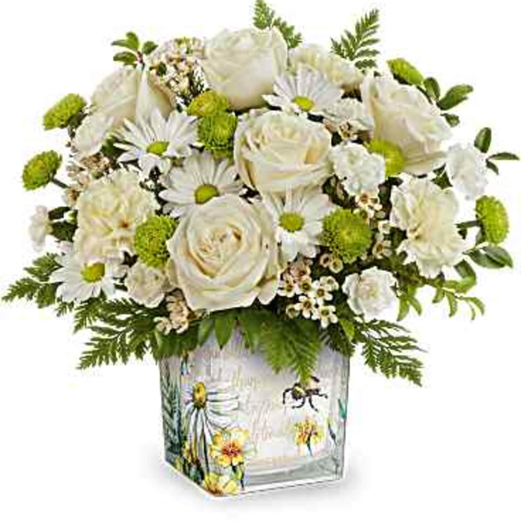 White roses and daisies in a decorated glass vase