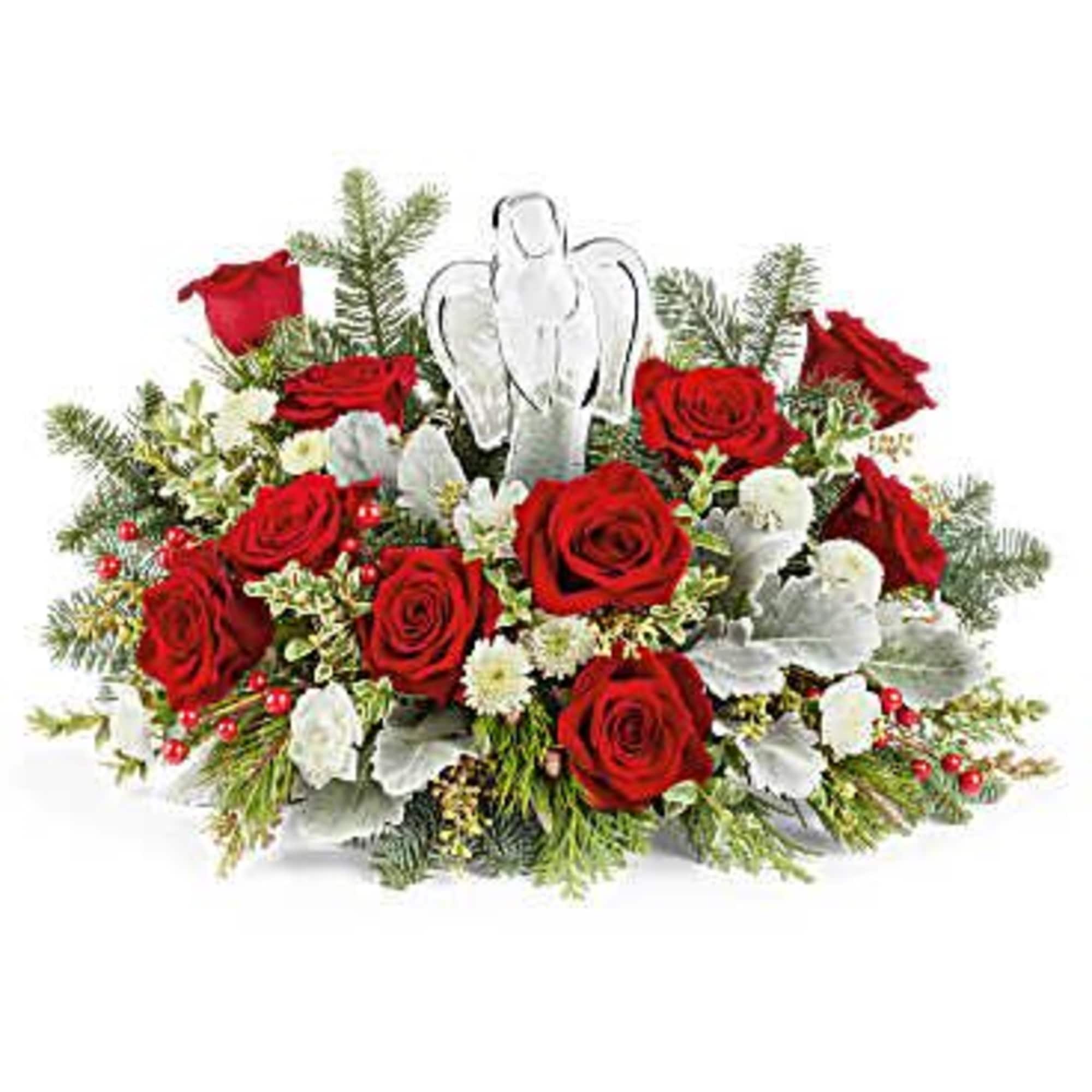 Red roses arranged with silver foliage and a clear angel ornament