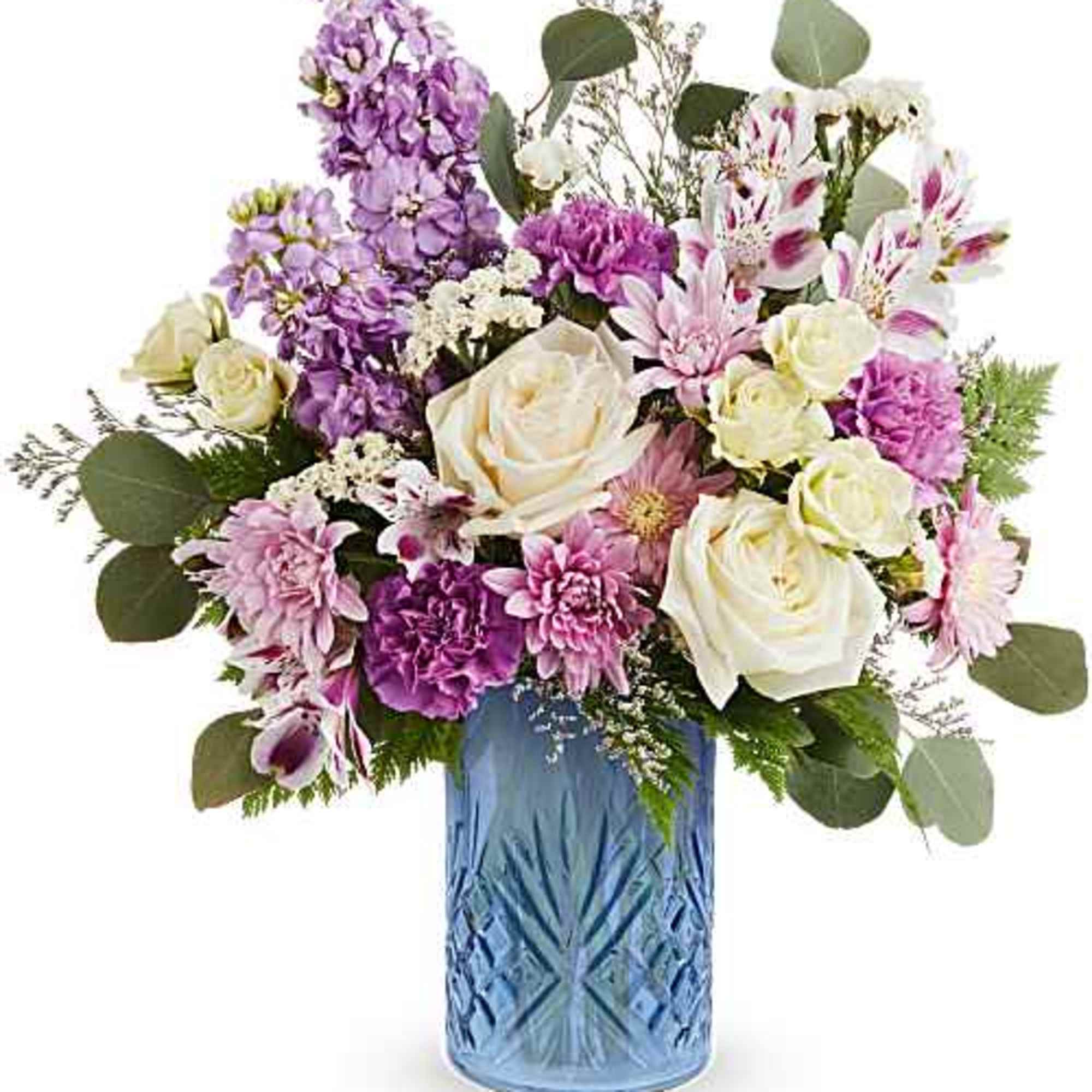 Soft, romantic pastels arranged in a cool blue vase make this birthday