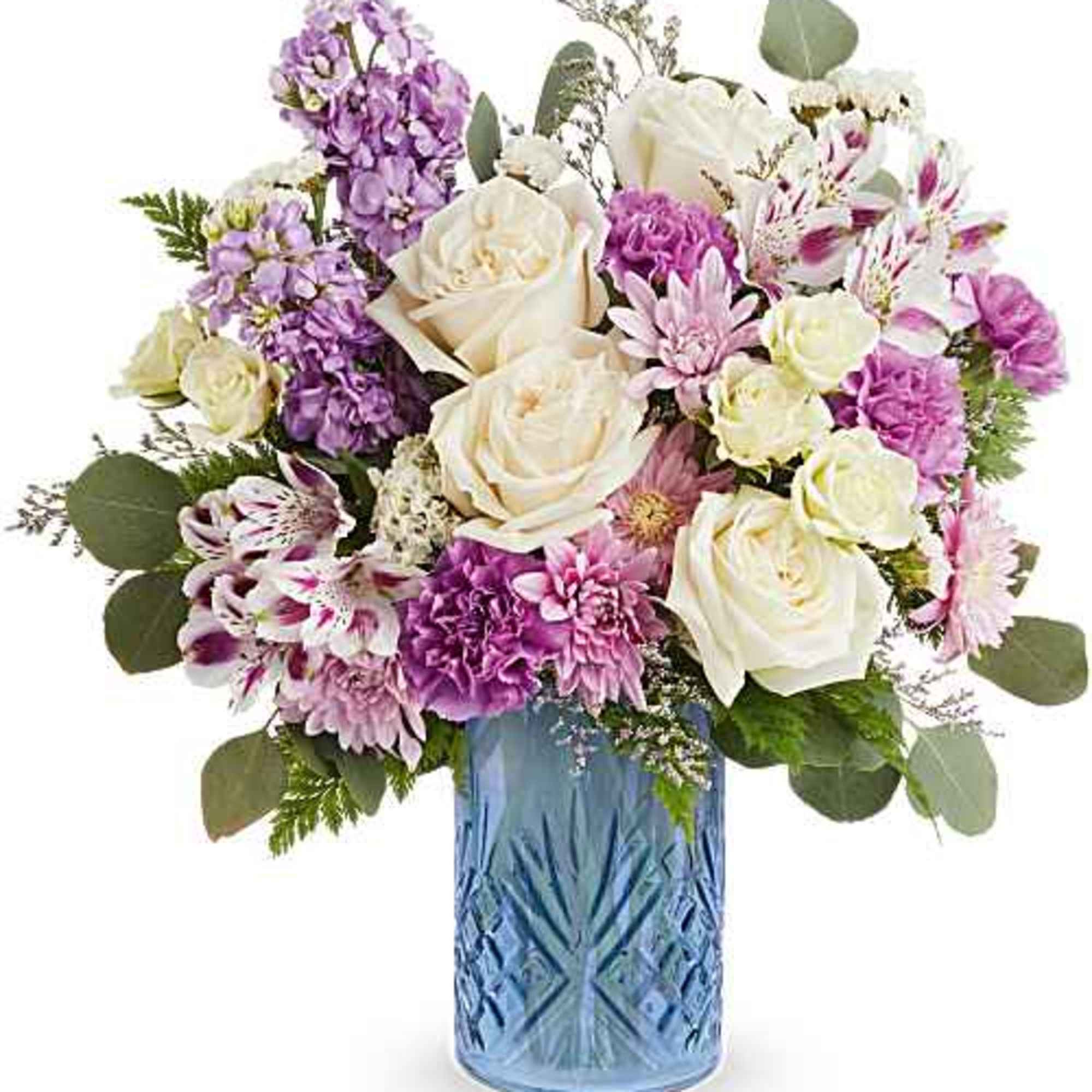 Soft, romantic pastels arranged in a cool blue vase make this birthday