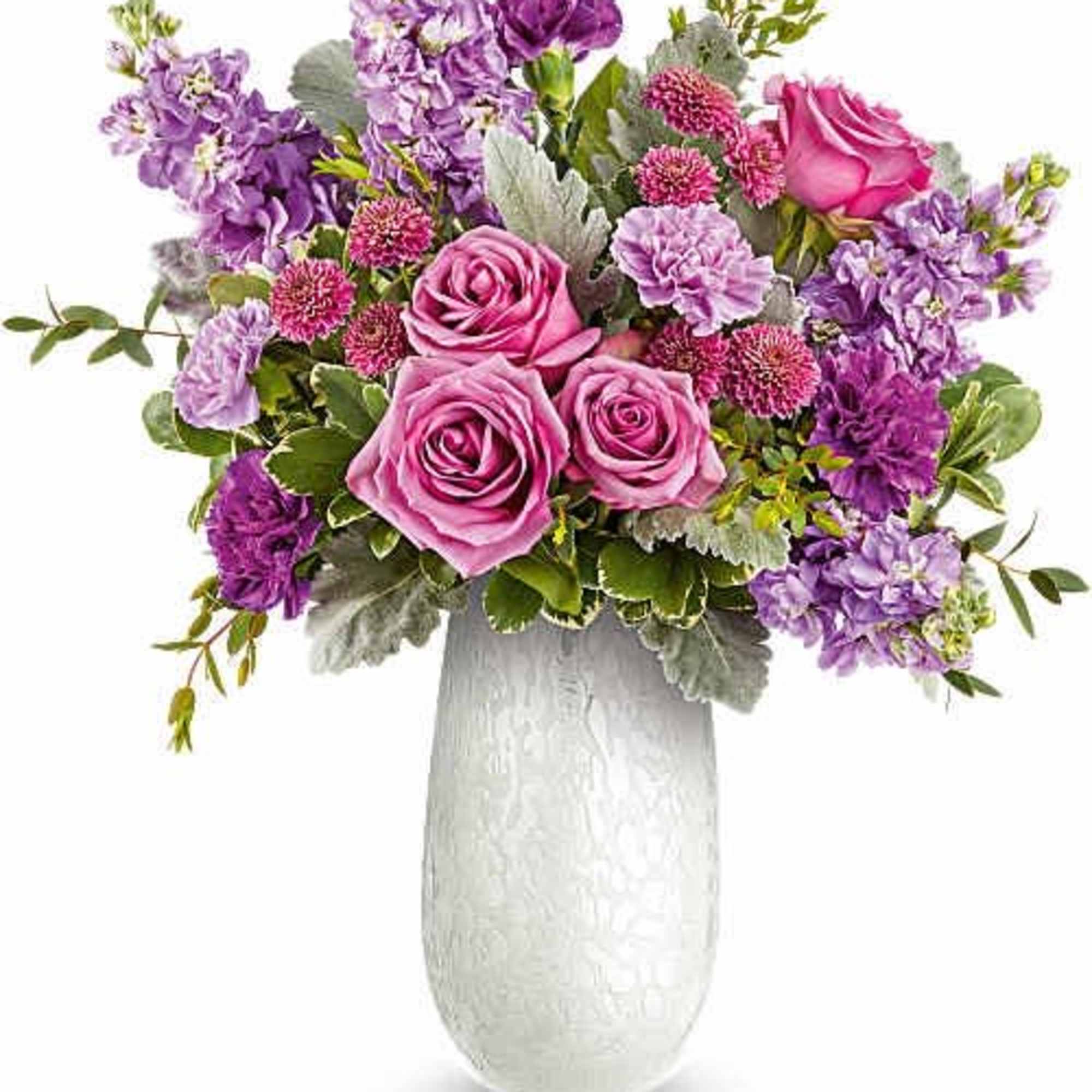 Soft pink roses clustered at the heart give this flower arrangement a
