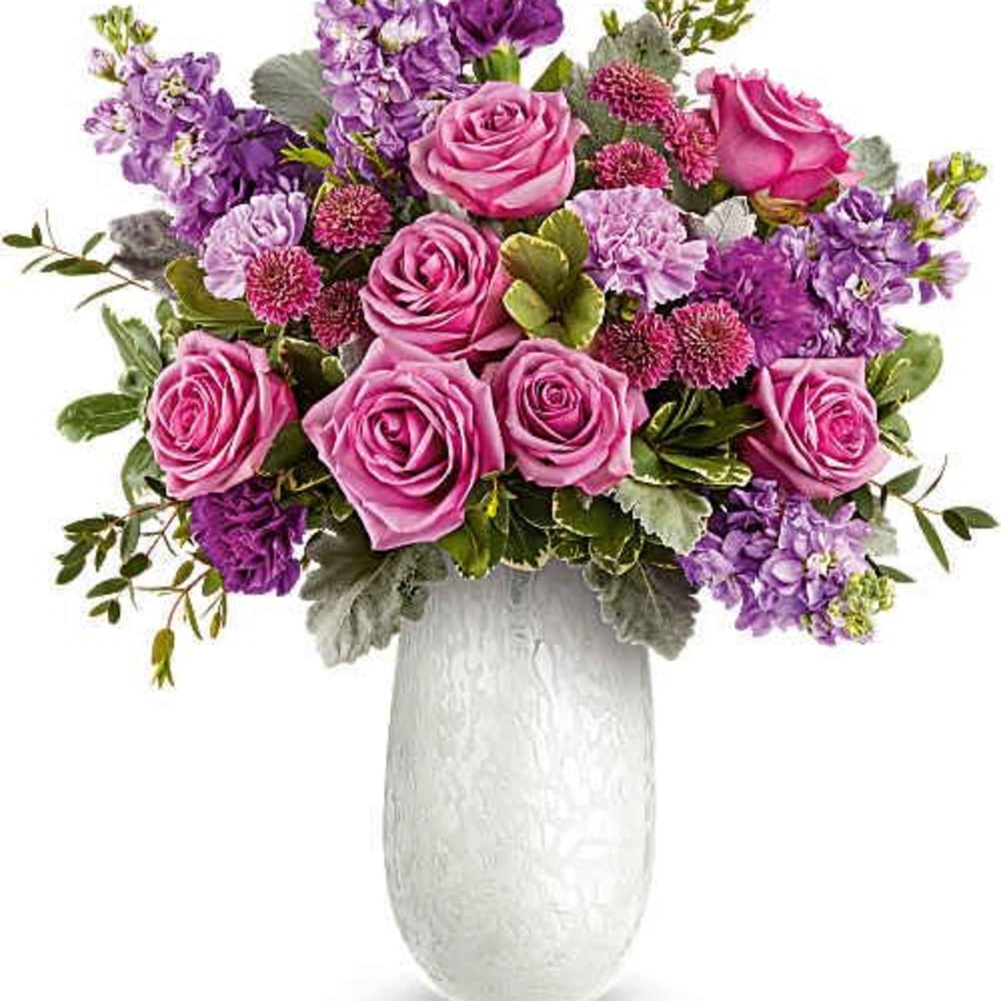 Soft pink roses clustered at the heart give this flower arrangement a