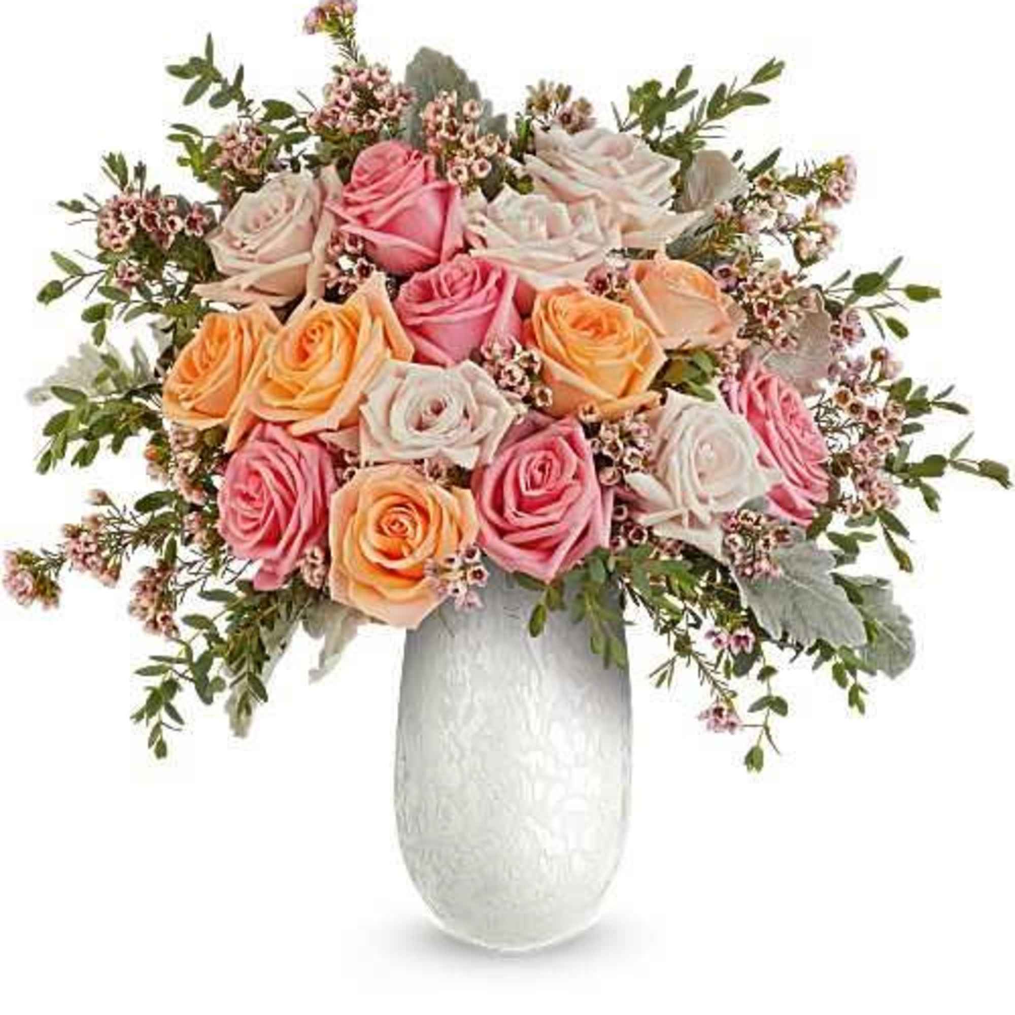 A lush dome of pink, peach and ivory roses creates an immediately