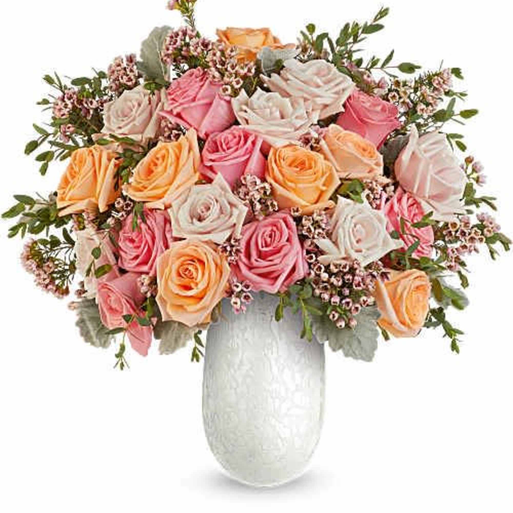 A lush dome of pink, peach and ivory roses creates an immediately