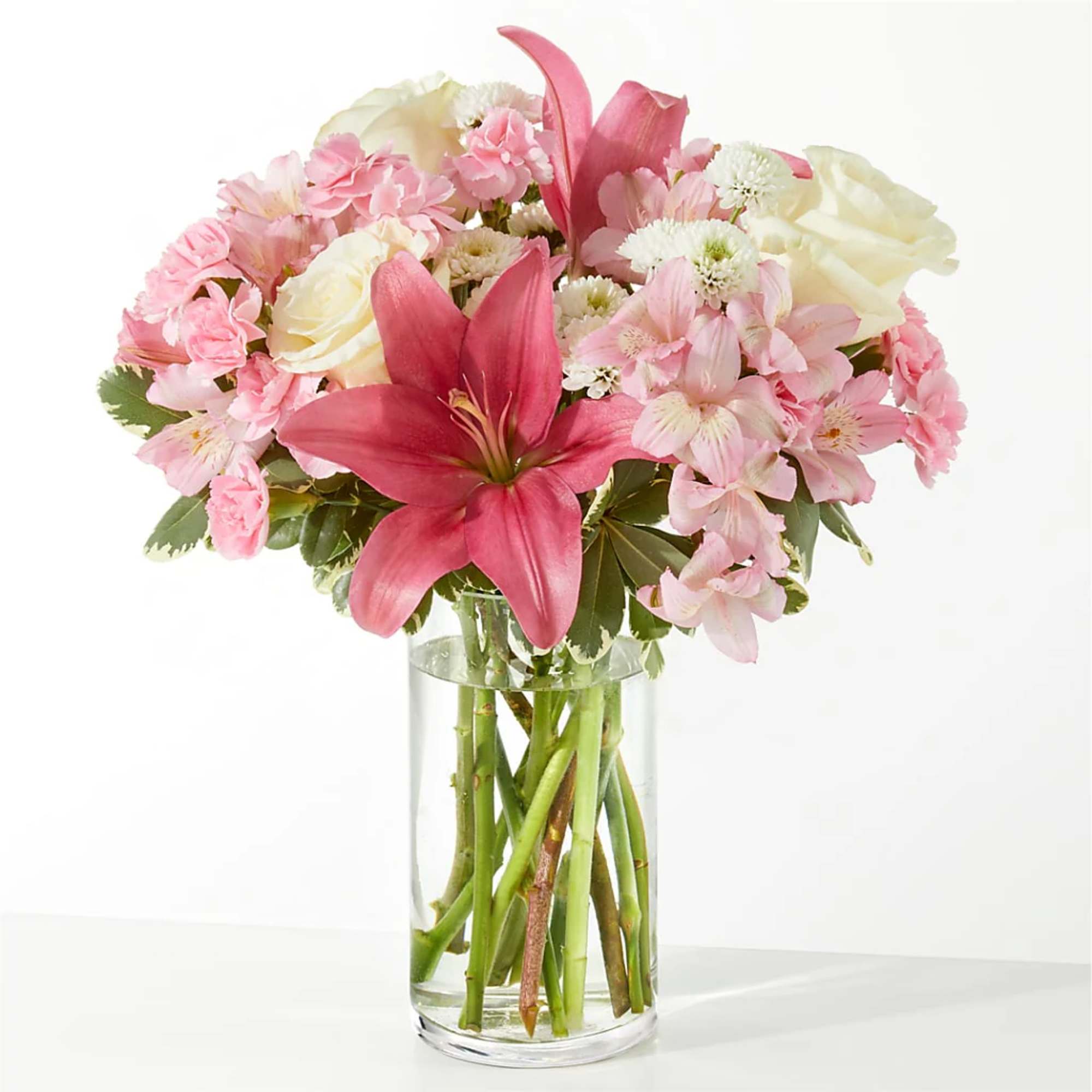 Pink and white mixed bouquet in a clear glass vase