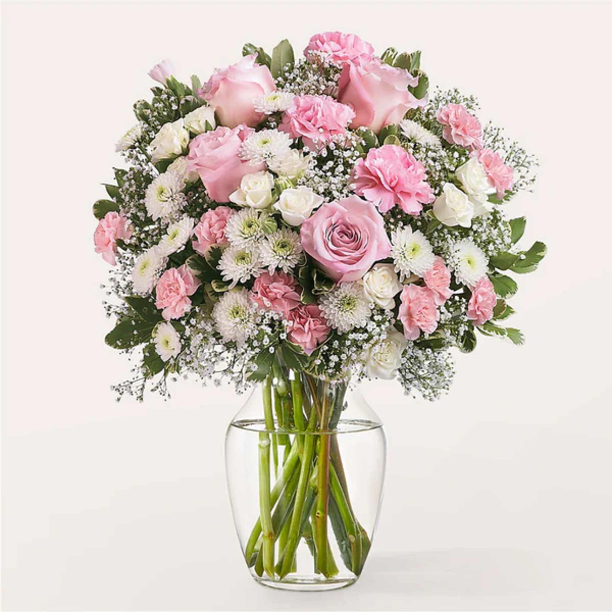 Pink and white mixed bouquet in a clear glass vase