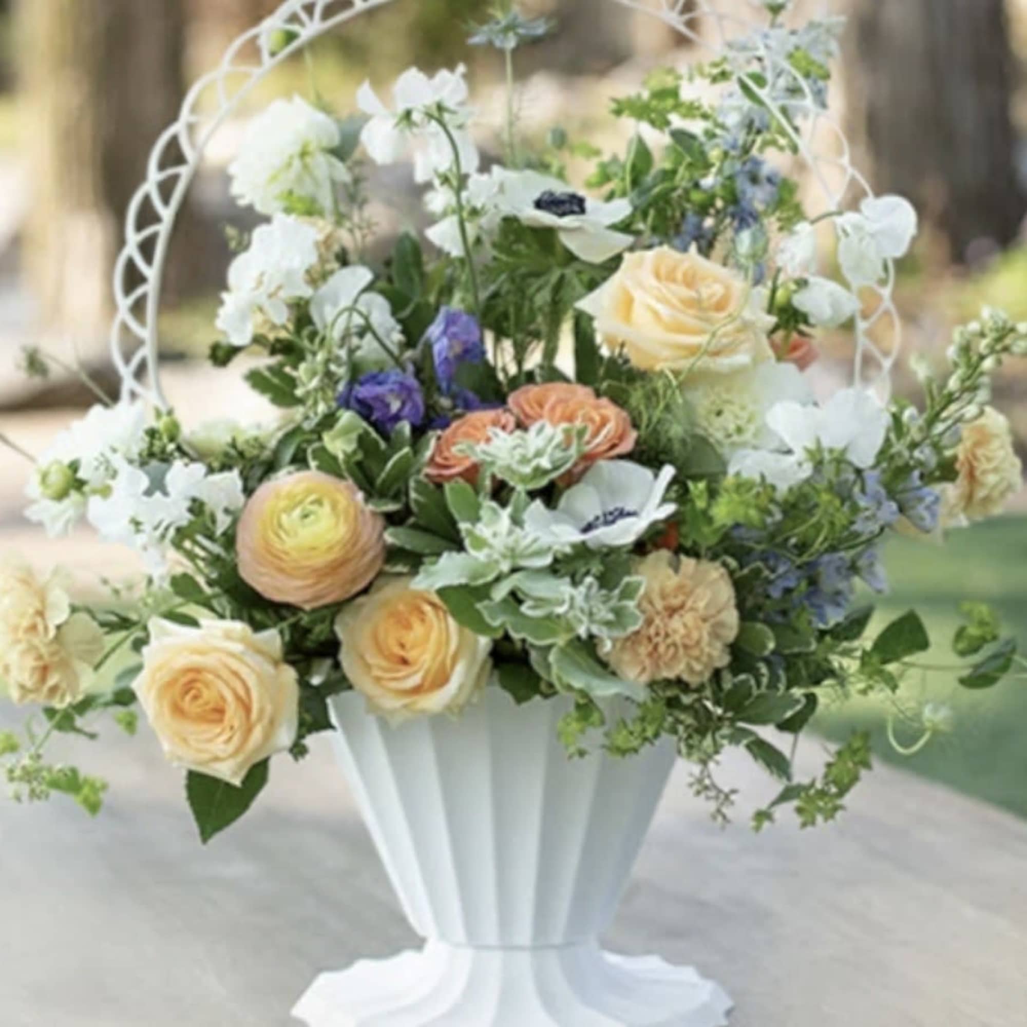 Send your Heartfelt Condolences with this flower filled basket arrangement. Contains an