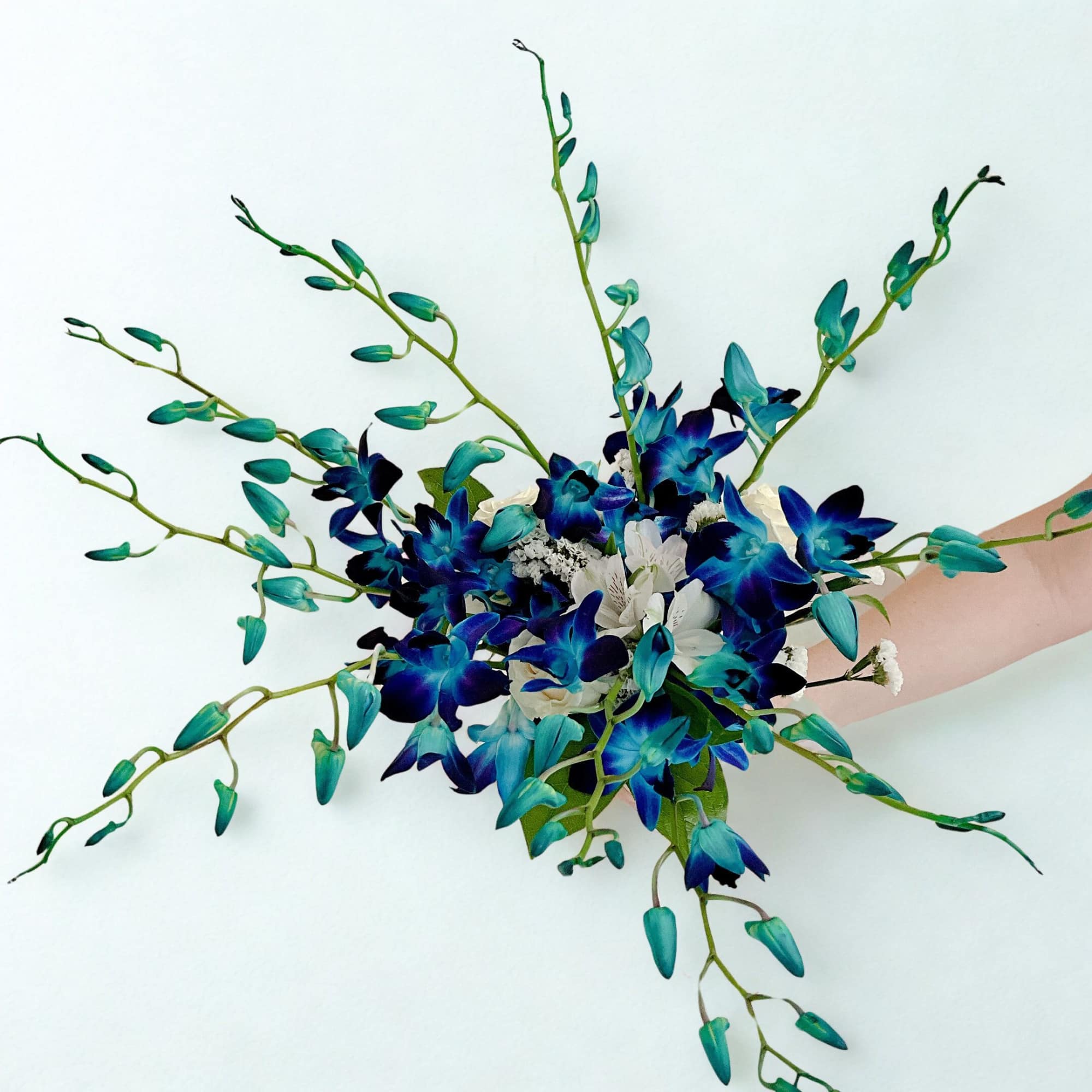 Blue and teal floral bouquet with long arching stems