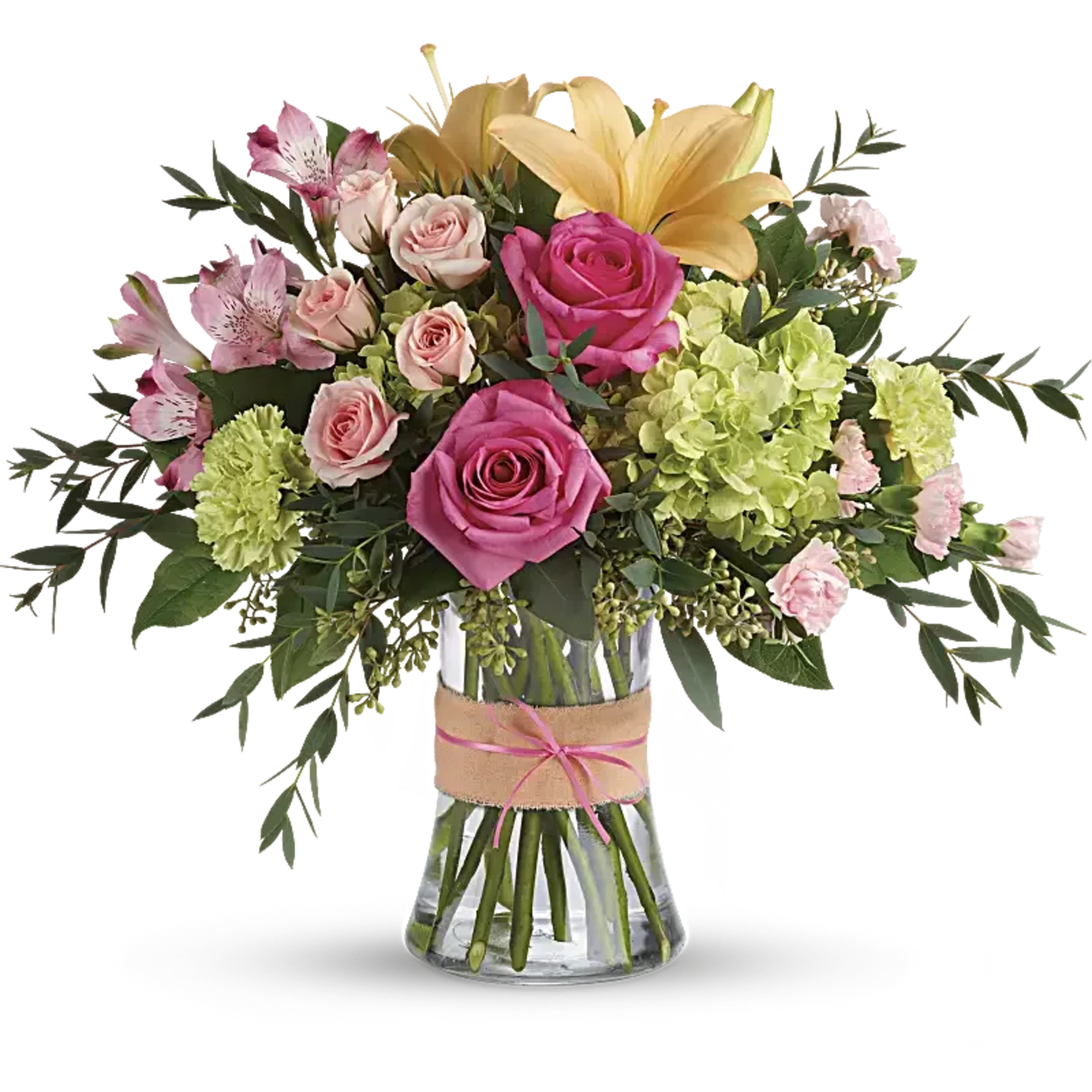 Bouquet of pink roses, lilies, and green hydrangeas in a glass vase