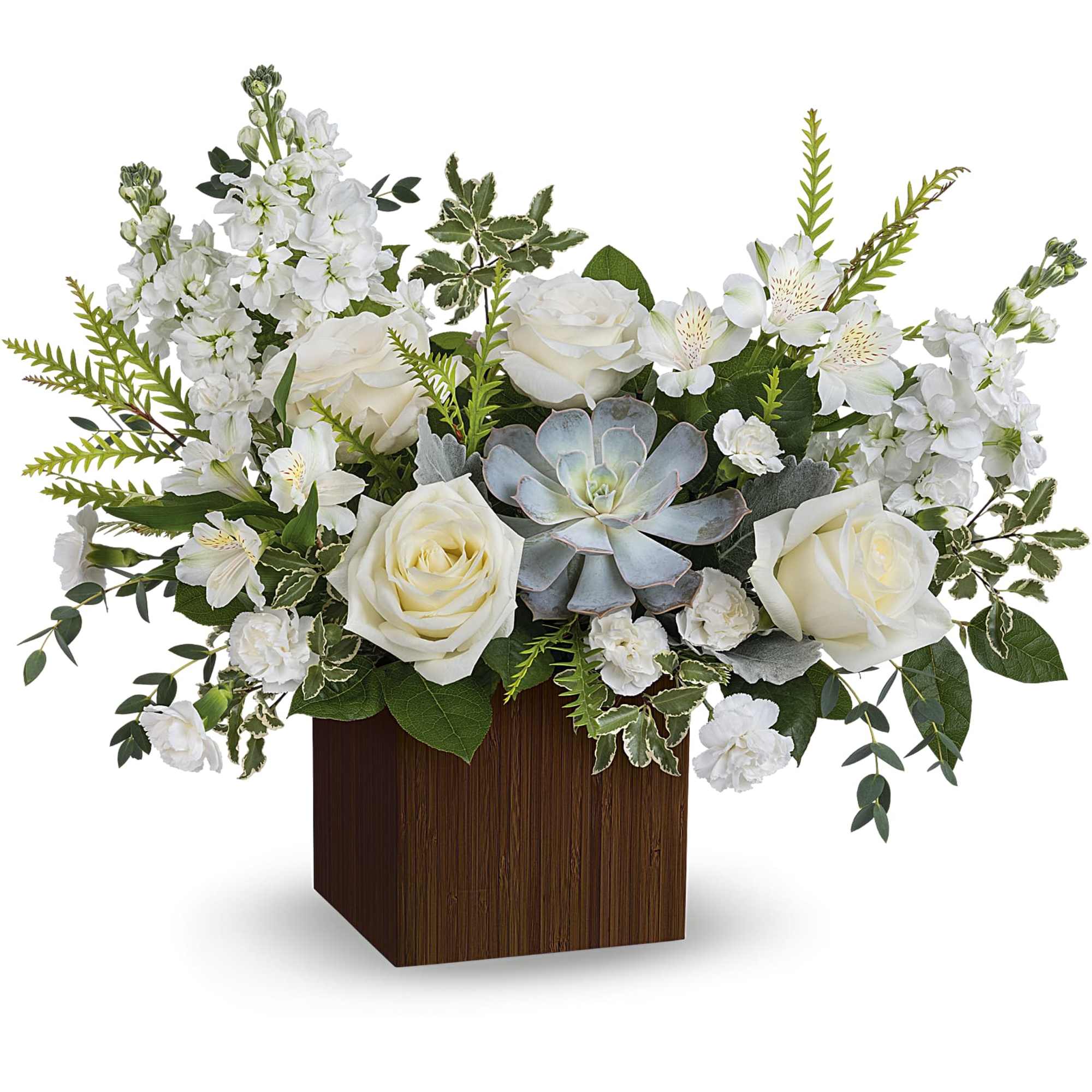 White roses and mixed white flowers in a wooden cube vase with a succulent centerpiece
