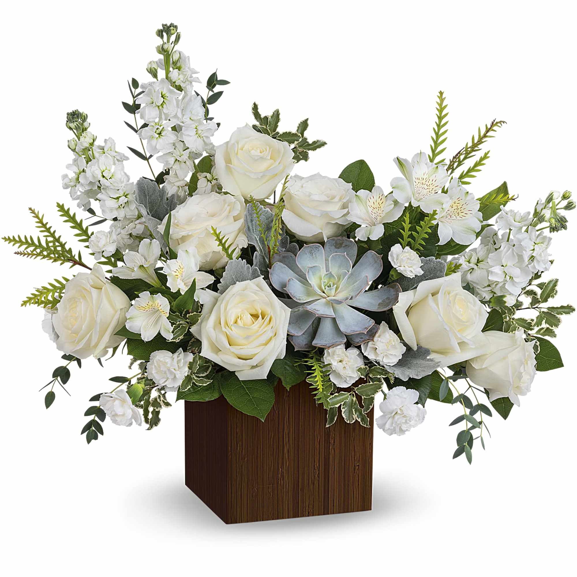 White roses and mixed white flowers arranged in a wooden cube vase