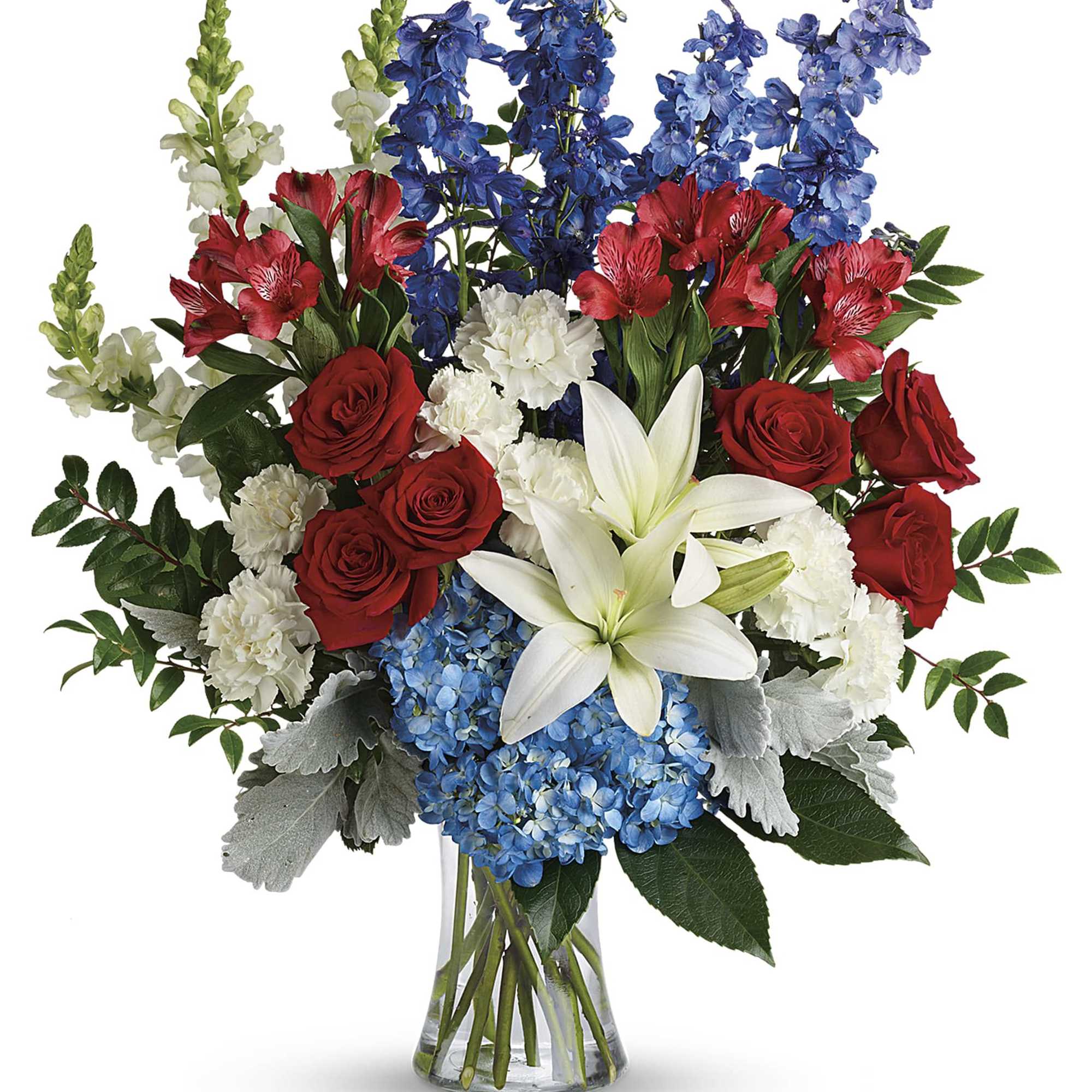 Bouquet of red roses, white lilies, blue flowers, and white blooms in a glass vase