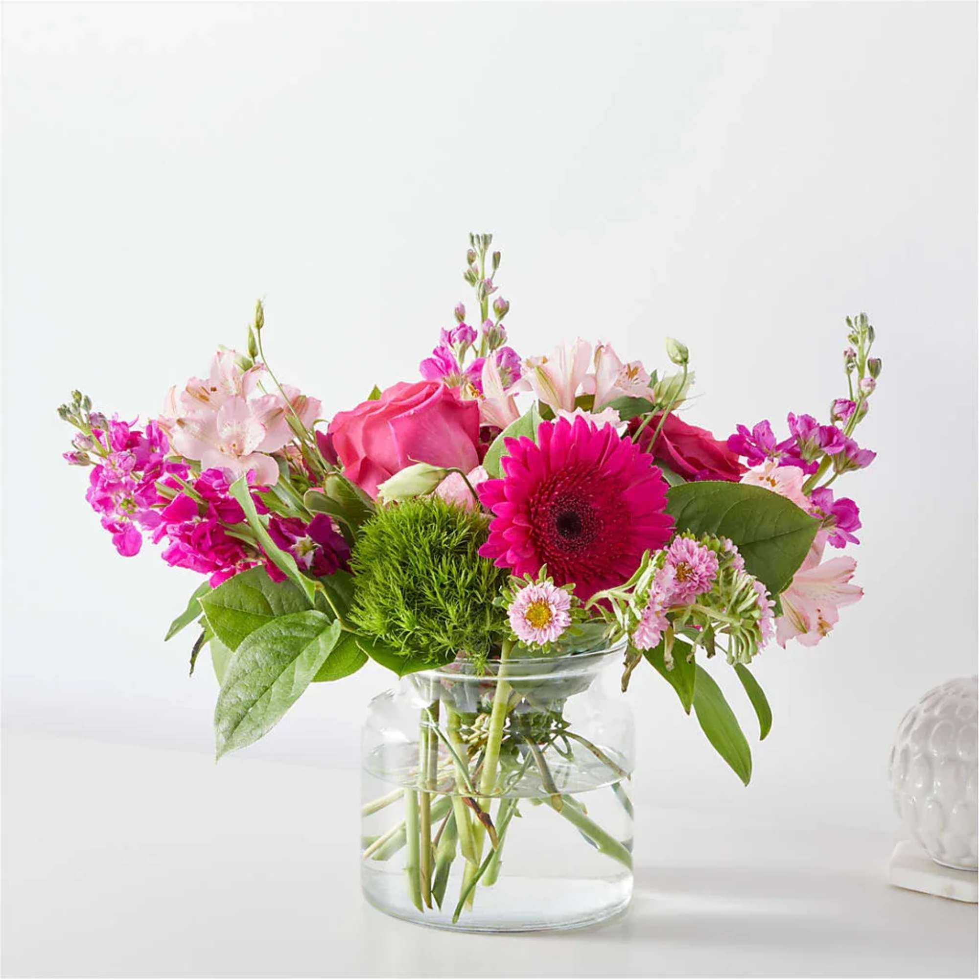 Pink mixed bouquet in a clear glass vase