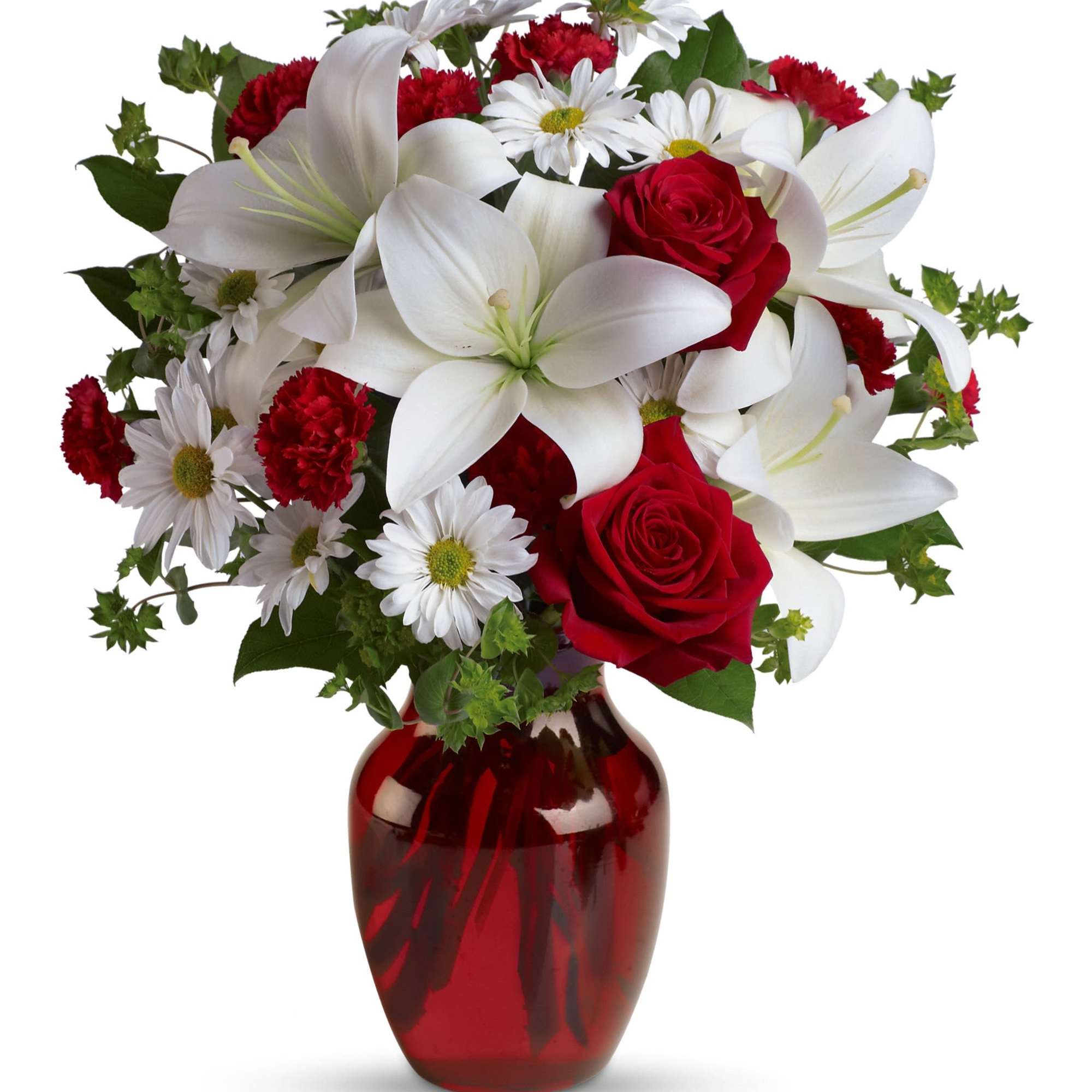 Bouquet of red roses, white lilies, and daisies in a red glass vase