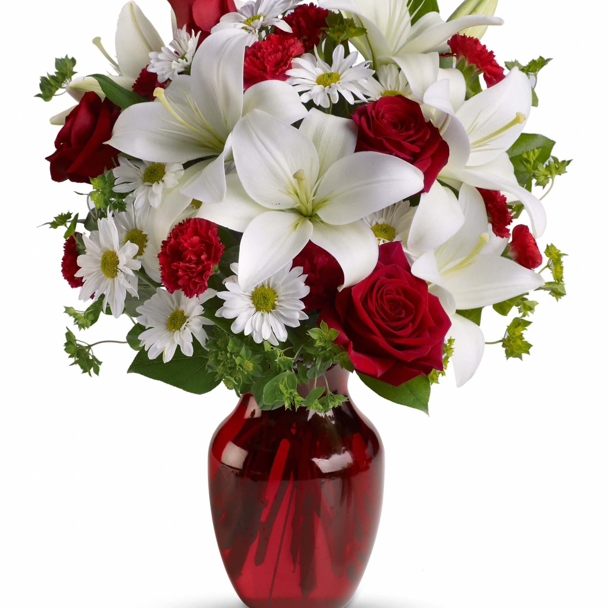 Red roses and white lilies arranged in a red glass vase