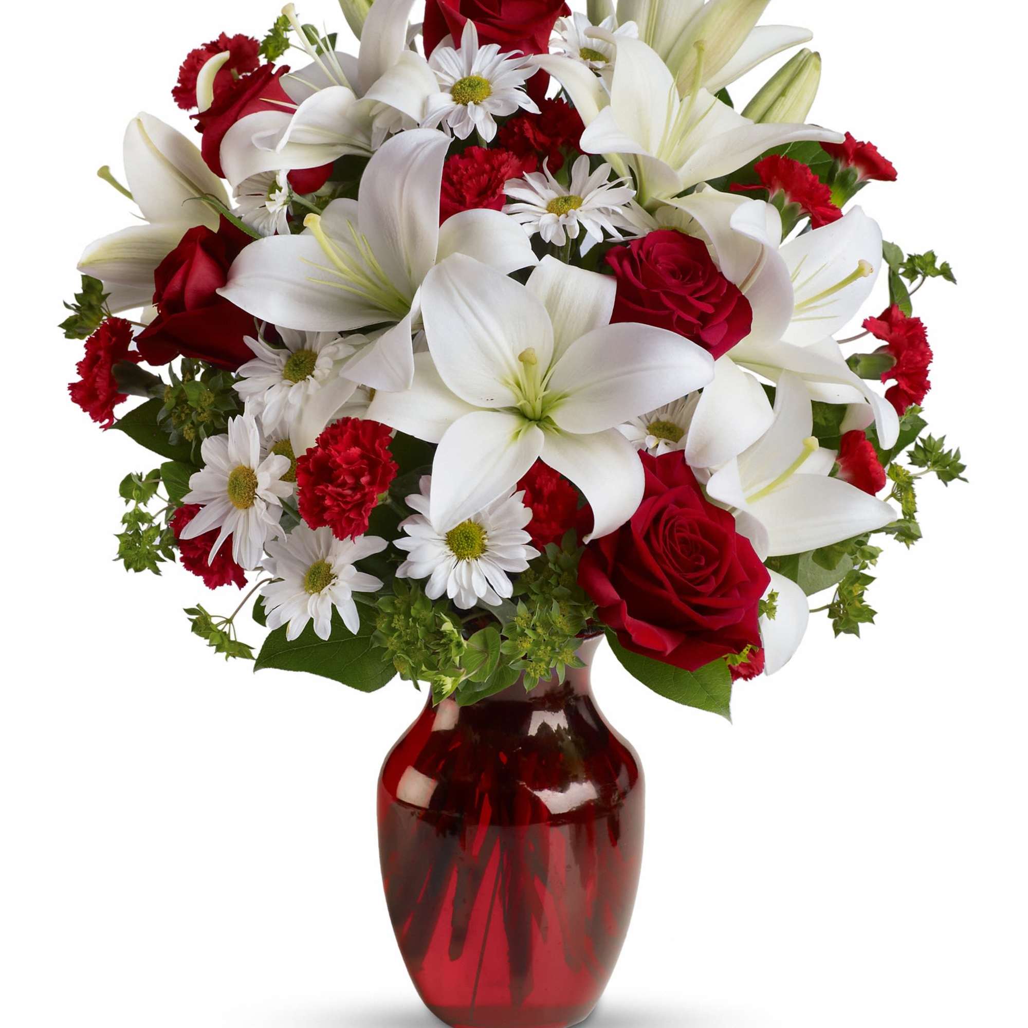 Bouquet of red roses, white lilies, and daisies in a red glass vase