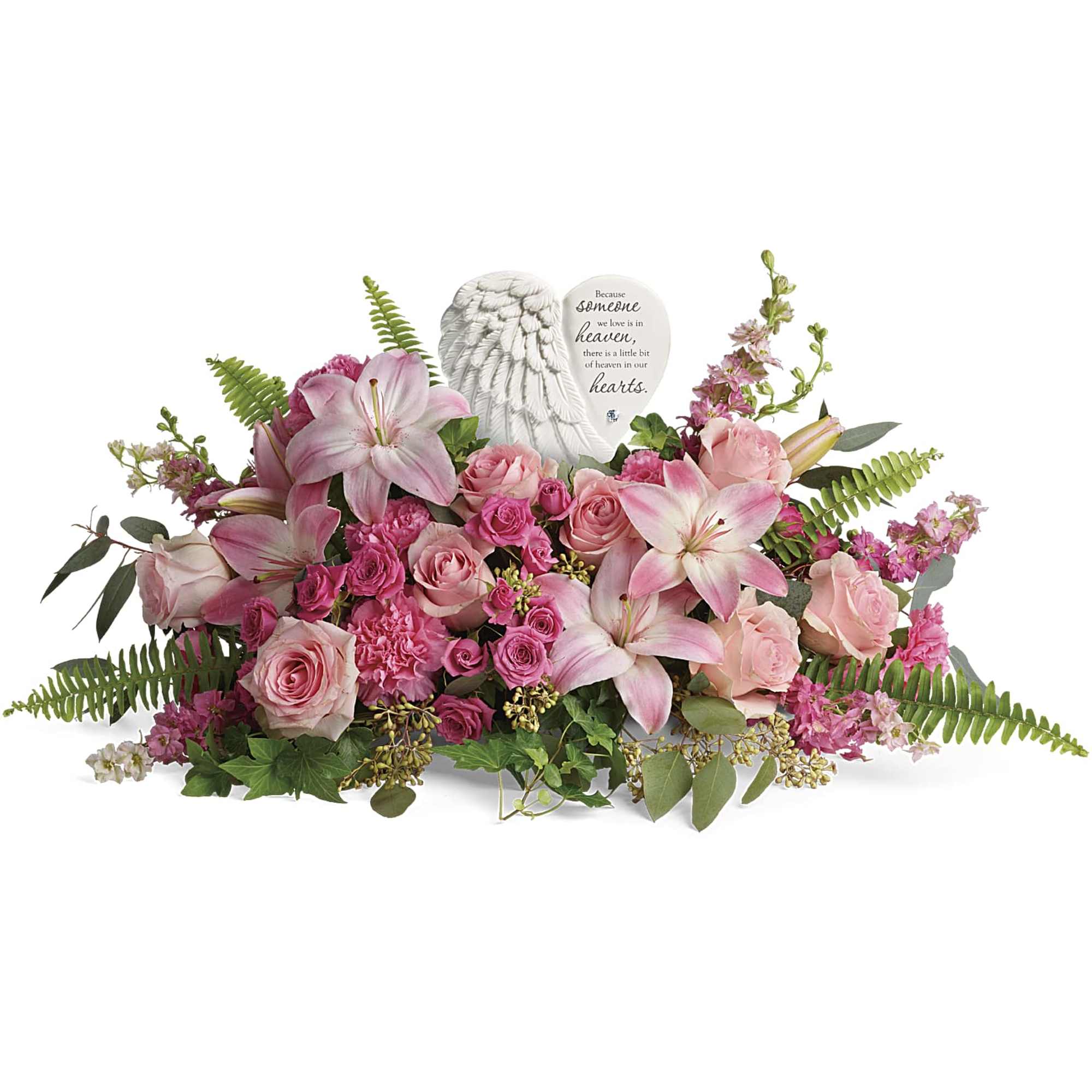 Pink lilies and roses arranged around a memorial angel plaque