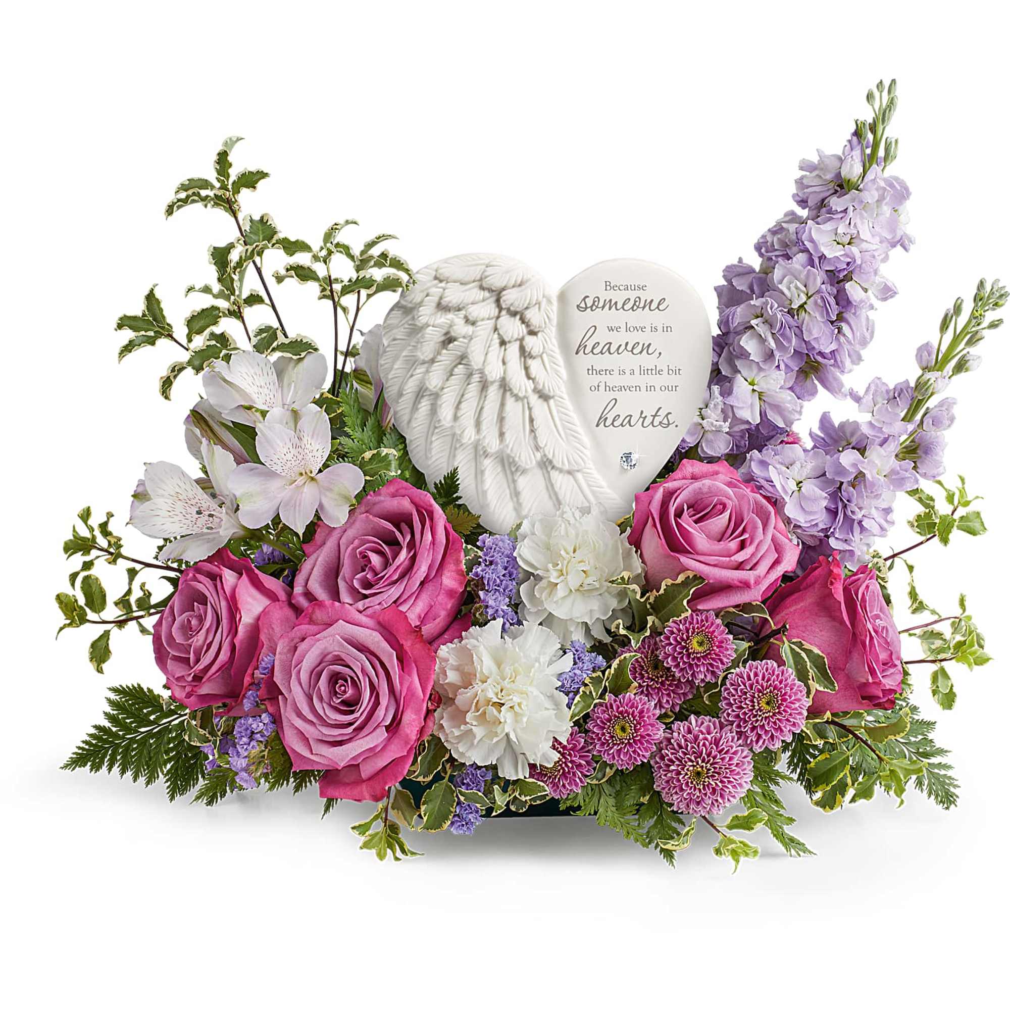 Pink roses and lavender flowers around a memorial heart plaque