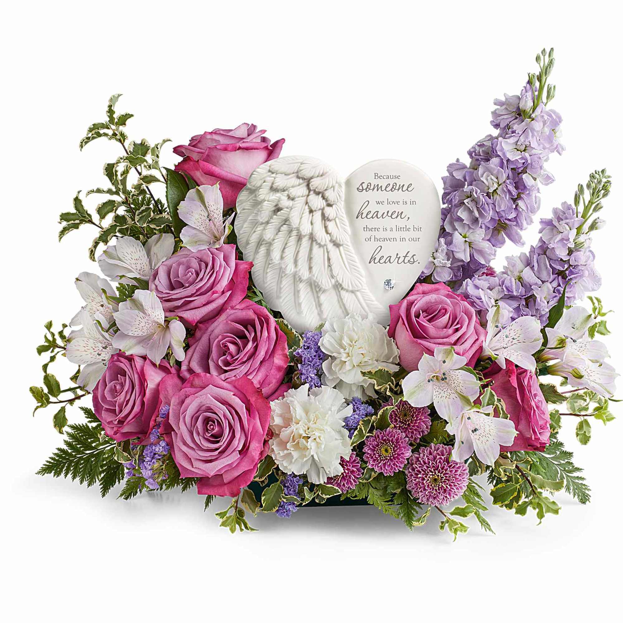 Pink roses and lavender flowers around a memorial angel plaque