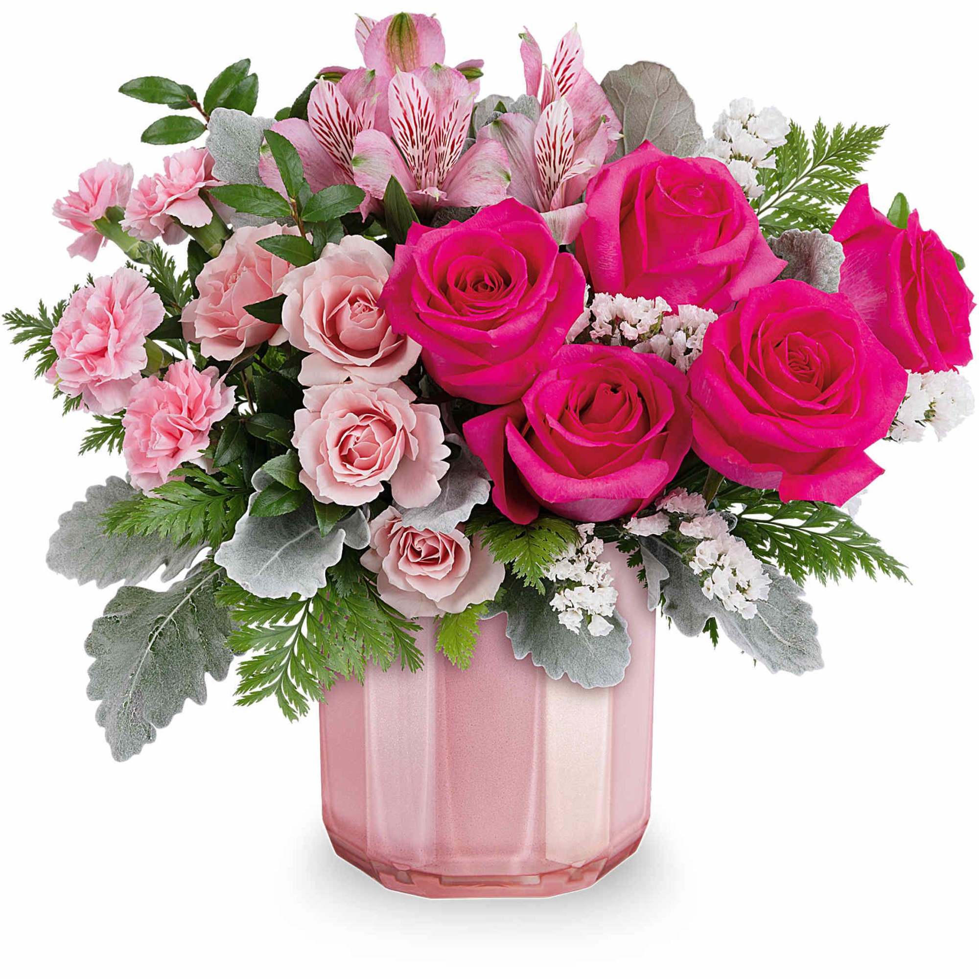 Pink roses and carnations in a pink glass vase