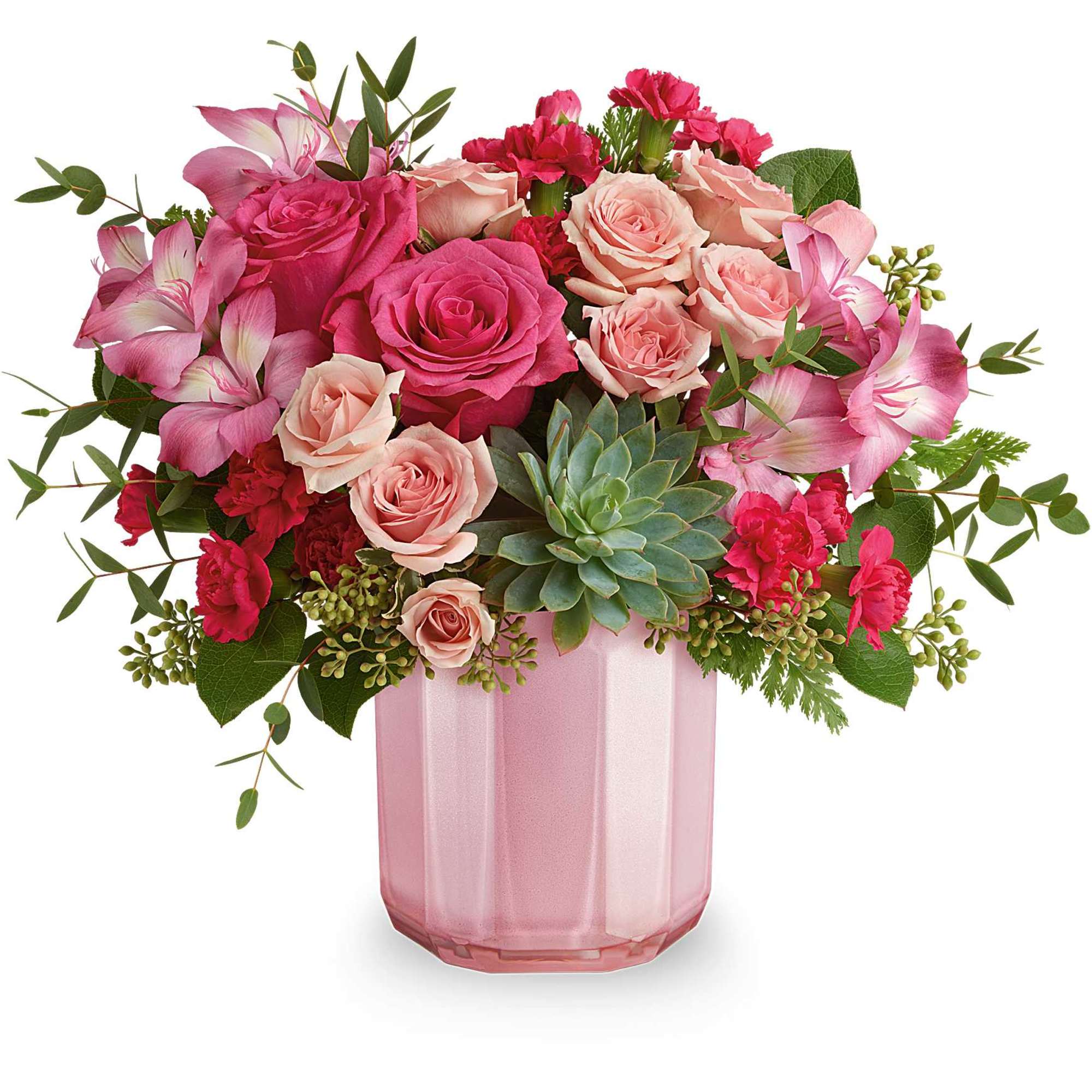 Pink and blush roses in a pink glass vase with succulents