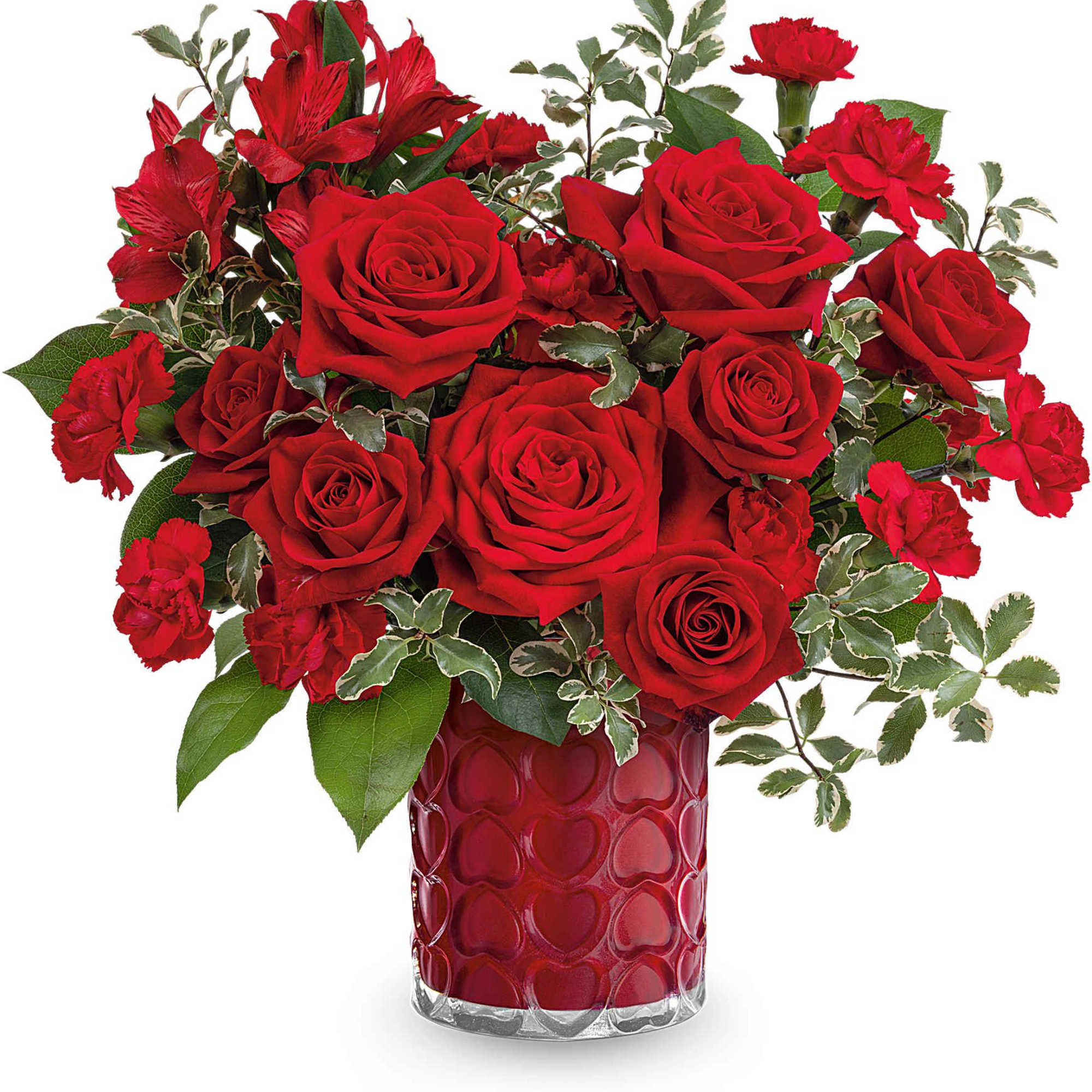 Red roses and carnations in a red heart-pattern vase